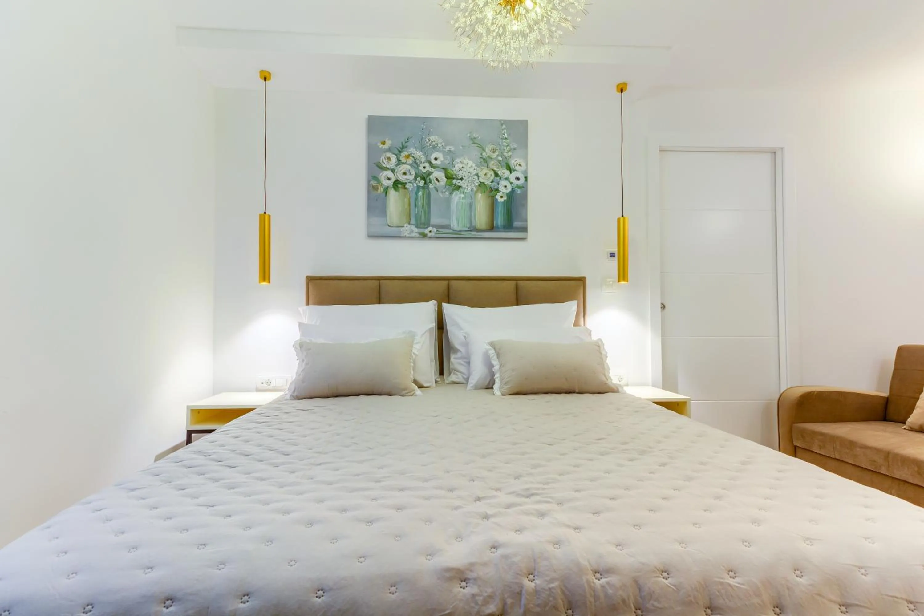 Bed in Irini Luxury Rooms