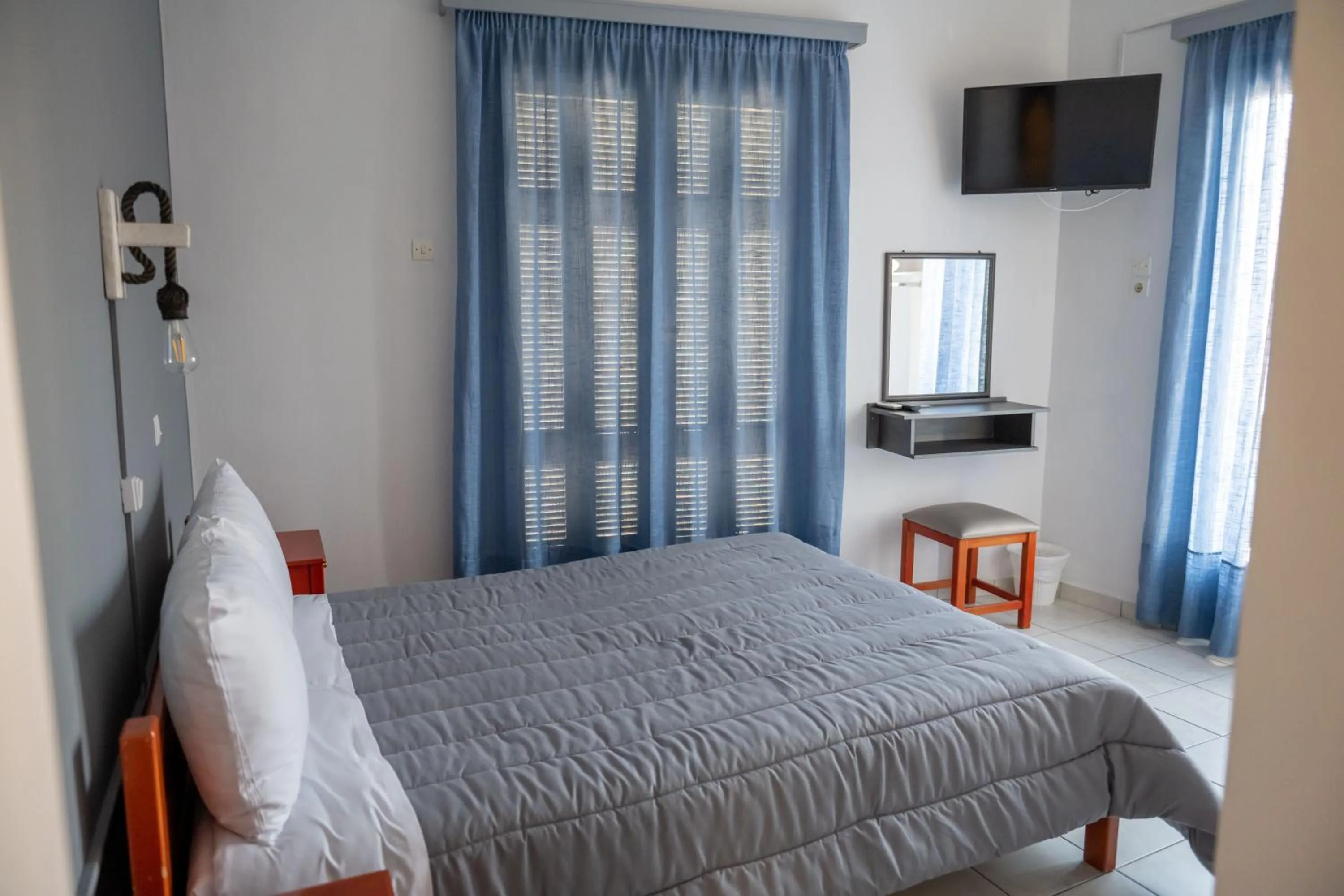 Bed in Hotel Theoxenia