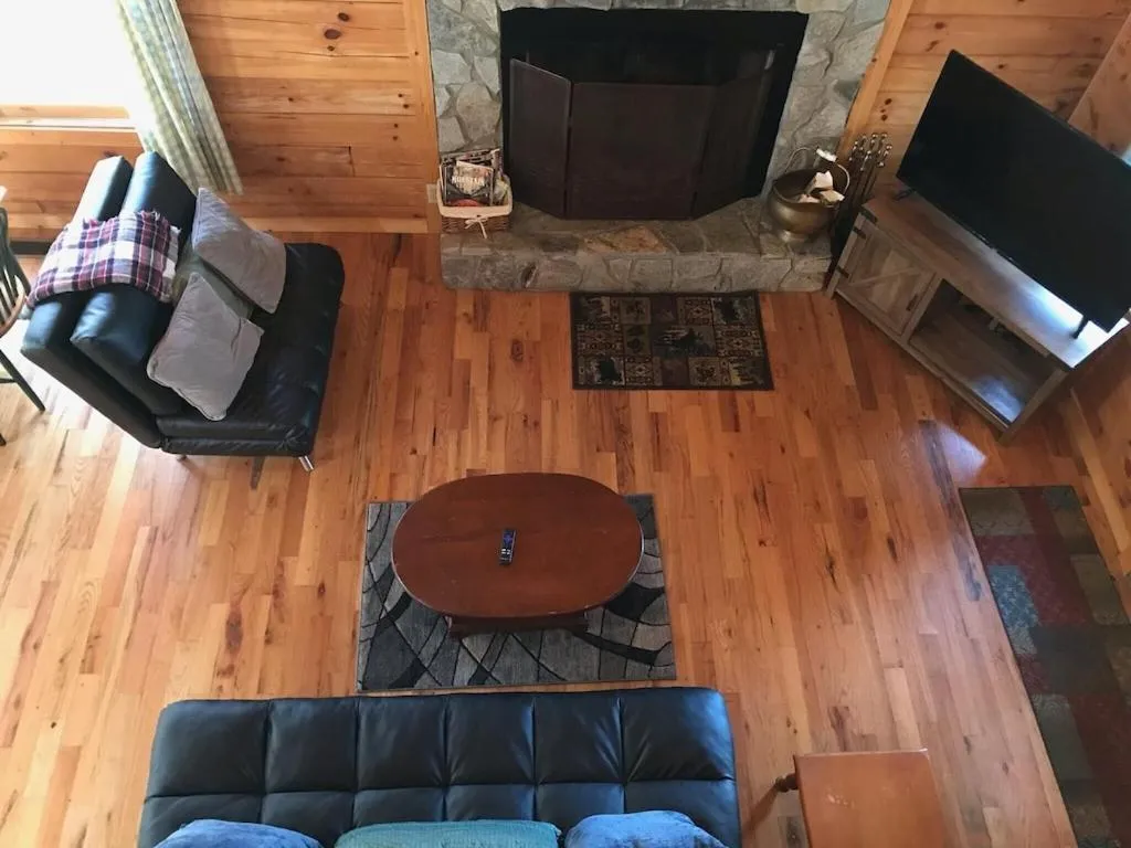 Seating area in Alpenhaus Cabins Real Log Home in Helen Ga Mountains with hot tub and balconies