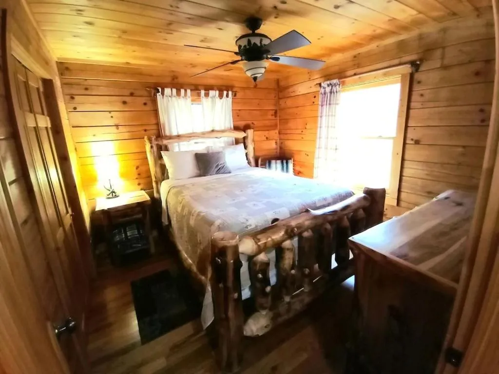 Bedroom, Bed in Alpenhaus Cabins Real Log Home in Helen Ga Mountains with hot tub and balconies