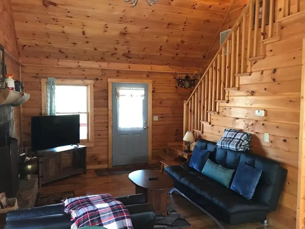 Living room in Alpenhaus Cabins Real Log Home in Helen Ga Mountains with hot tub and balconies