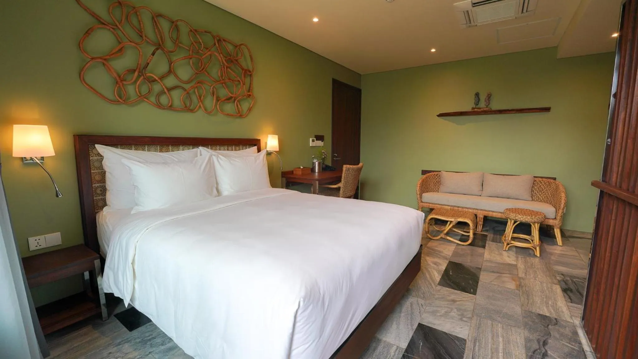 Seating area, Bed in CHiEM HoiAn - The Beachside Boutique Hotel & Villa