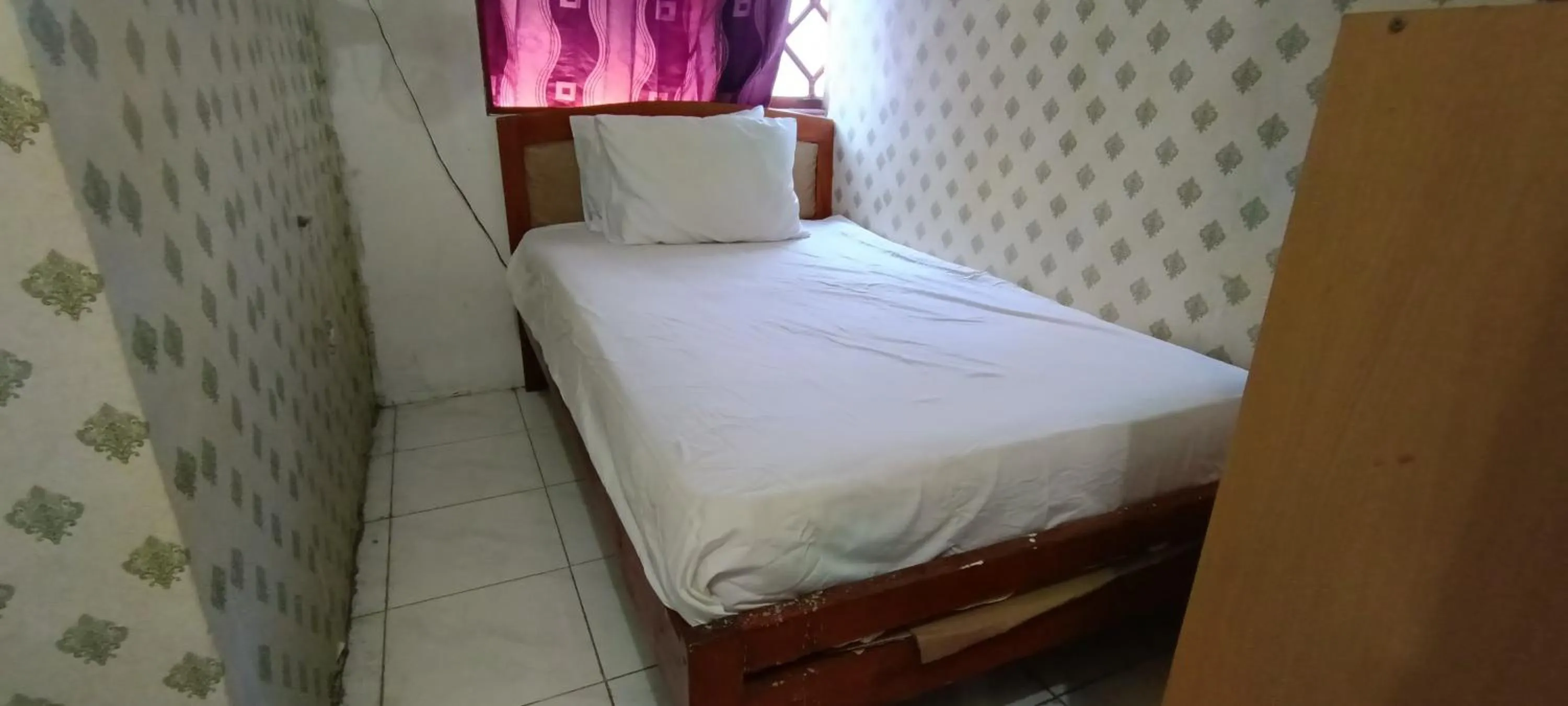 Bedroom in SPOT ON 92338 Karin Kost