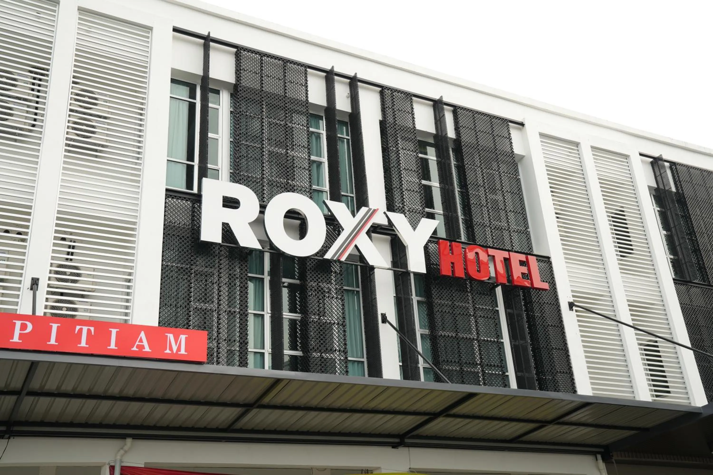 Property logo or sign in Roxy Hotel Aiman