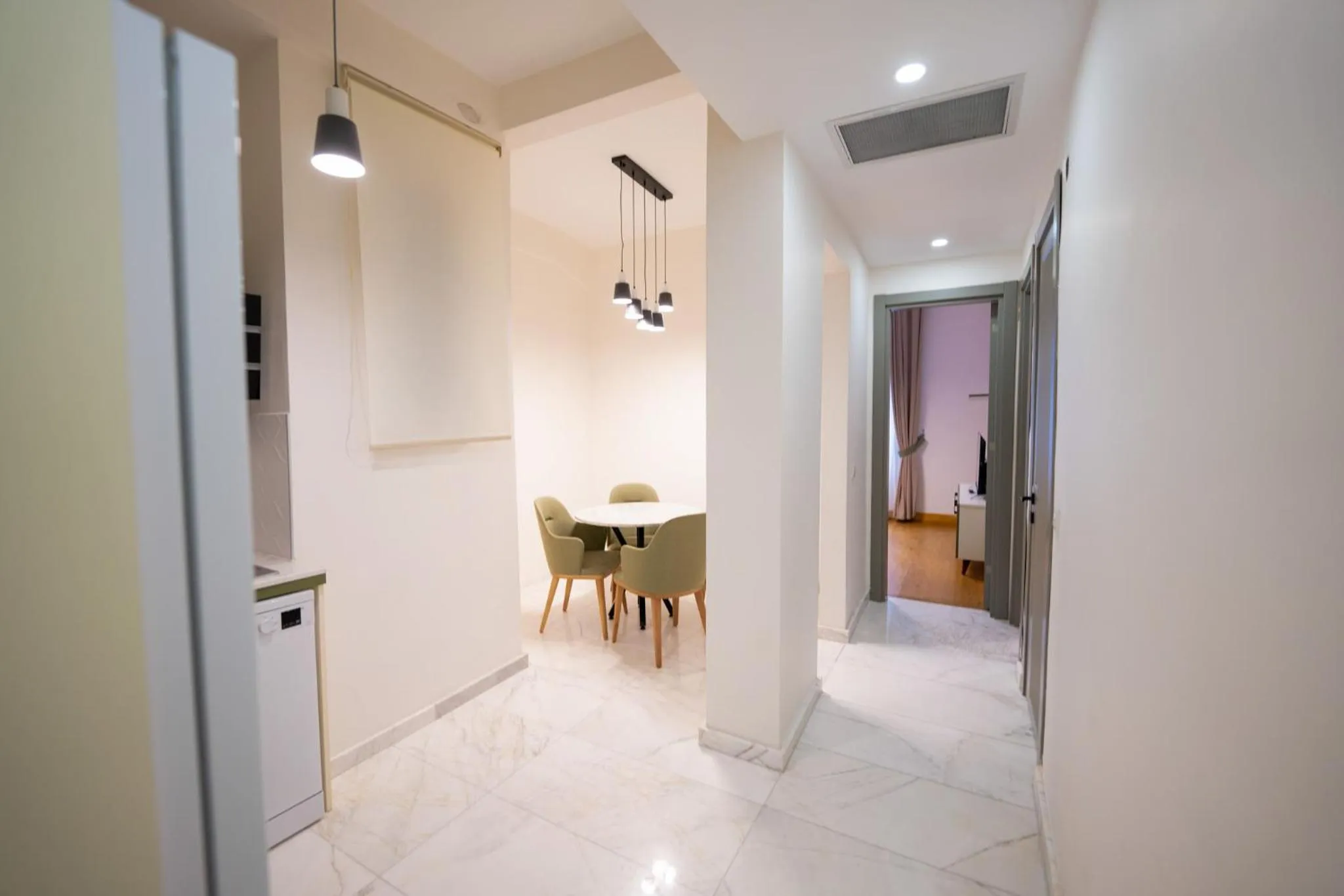 Kitchen or kitchenette in Monev Suites Hotel