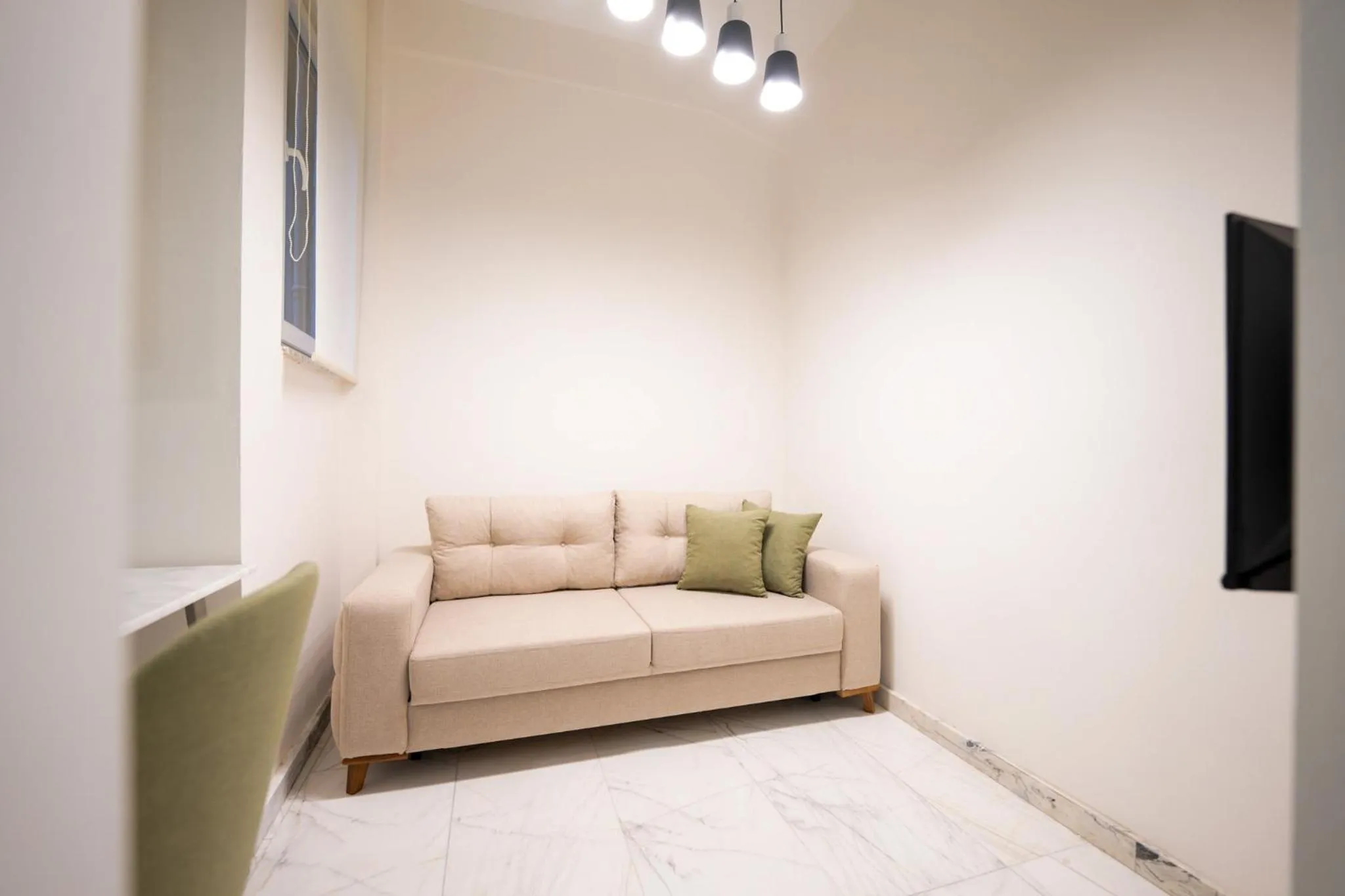 TV and multimedia in Monev Suites Hotel