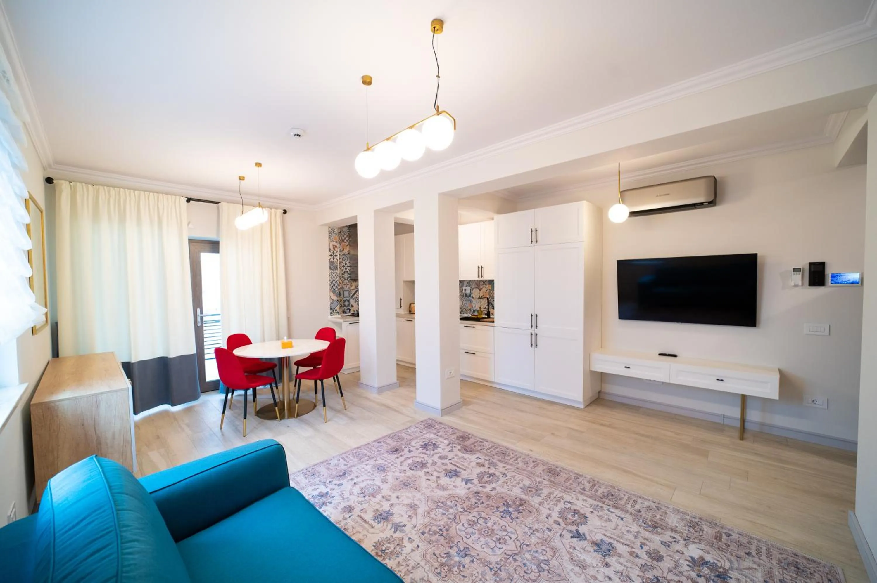 Kitchen or kitchenette in First Apartments