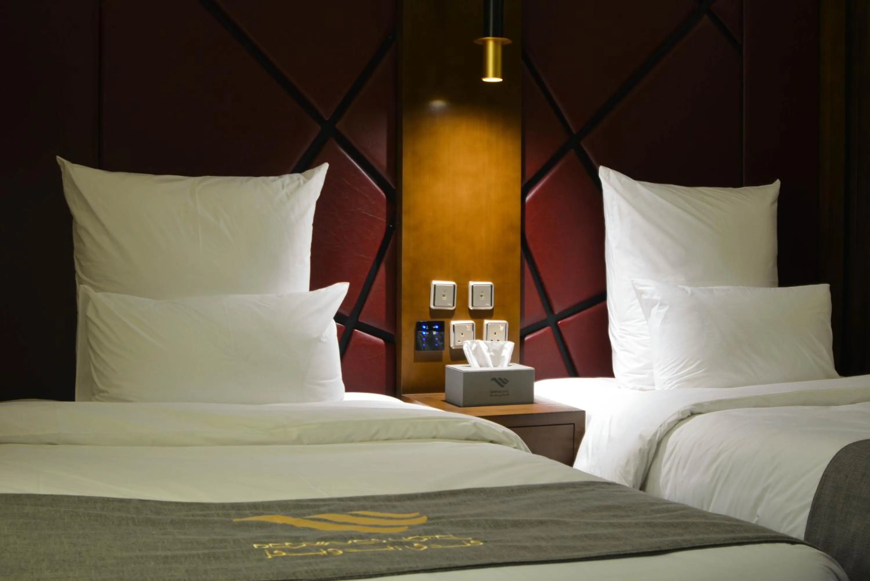 Bed in Redwaves Hotel