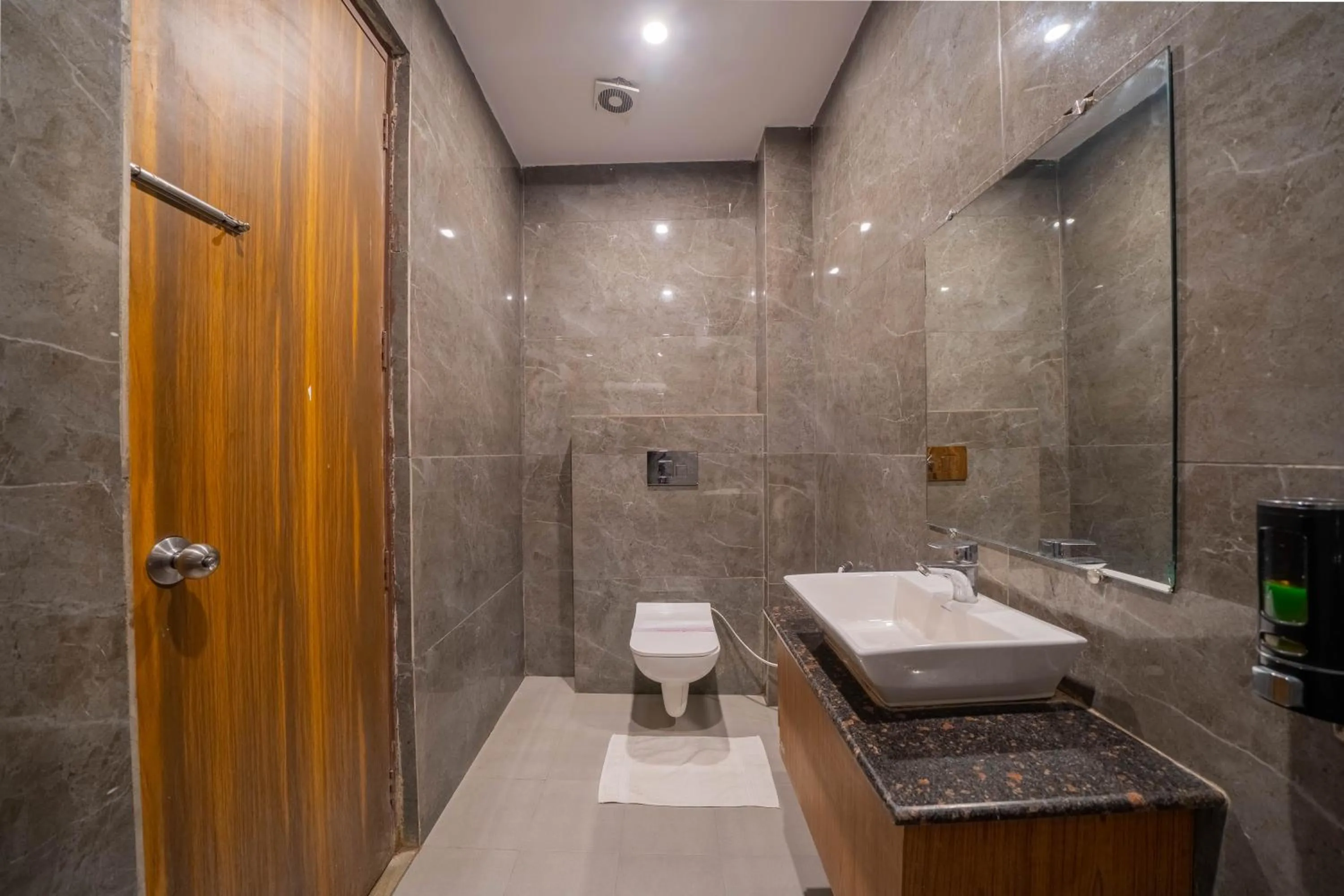 Bathroom in Perfectstayz Premium at Harkipauri Road - Ganga view rooftop cafe