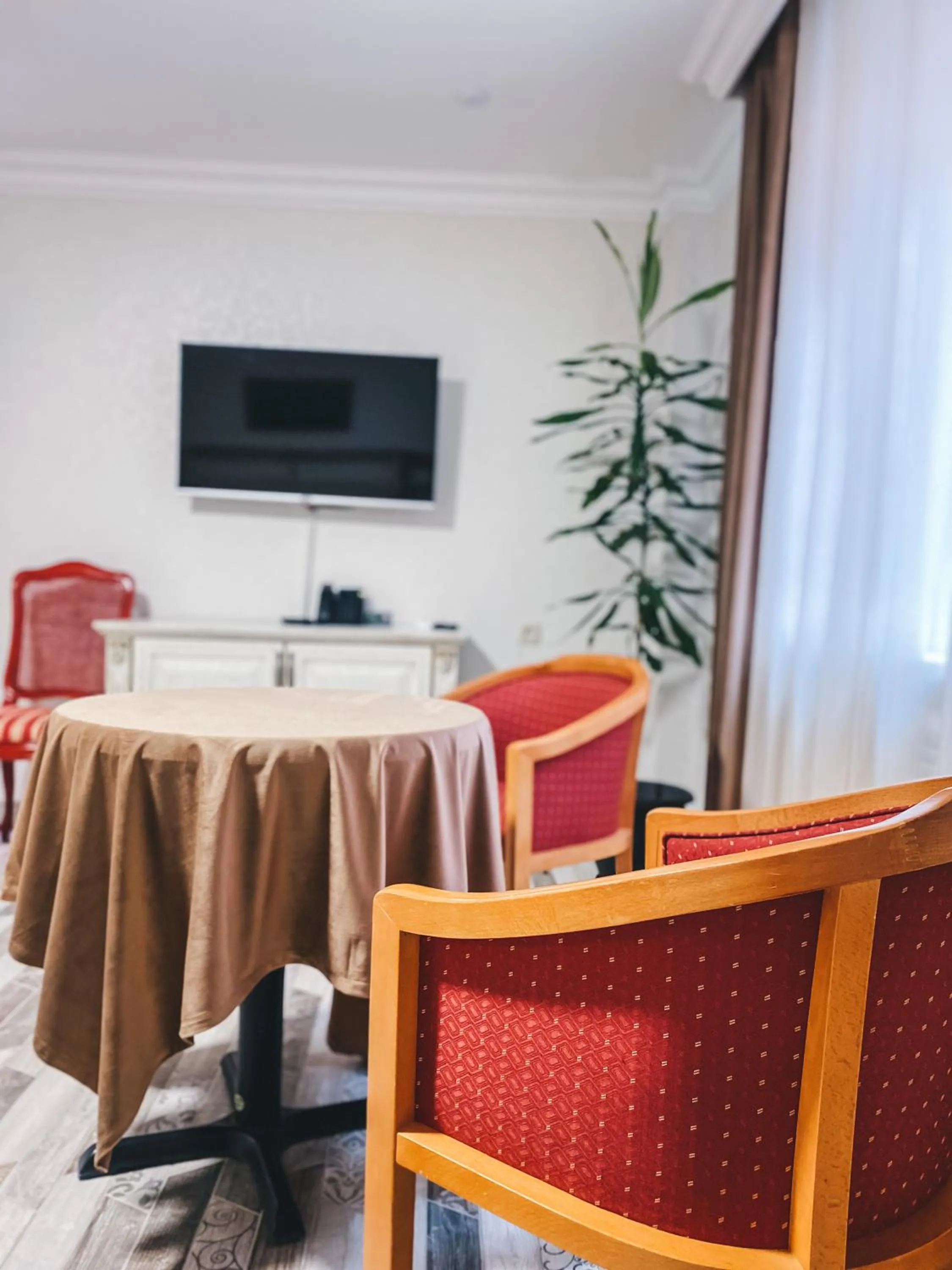 Communal lounge/ TV room in Aspar Boutique Hotel