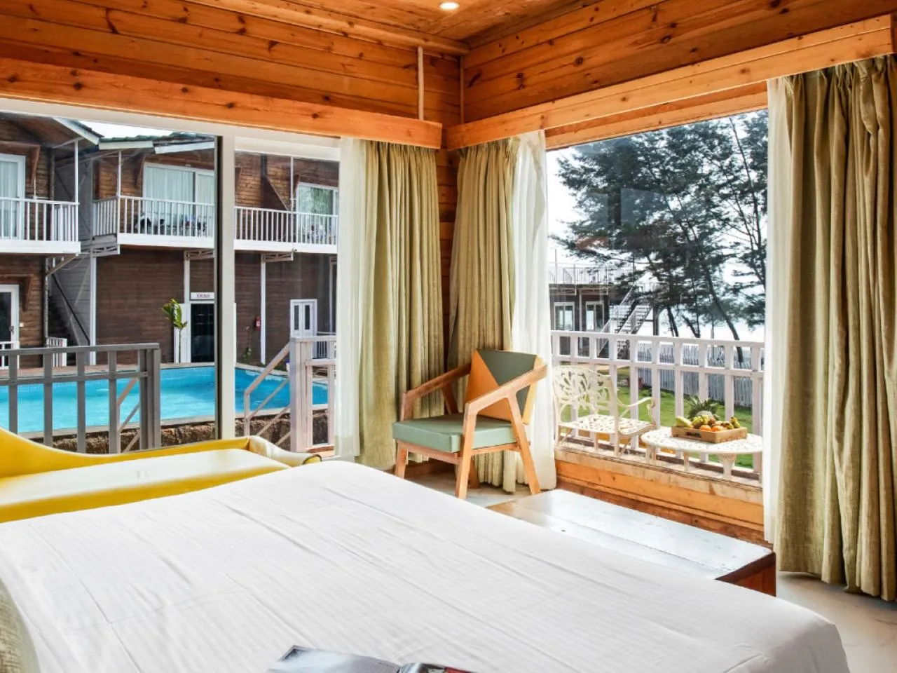 Pool view, Bed in Dallas Beach Resorts Ashvem Beach