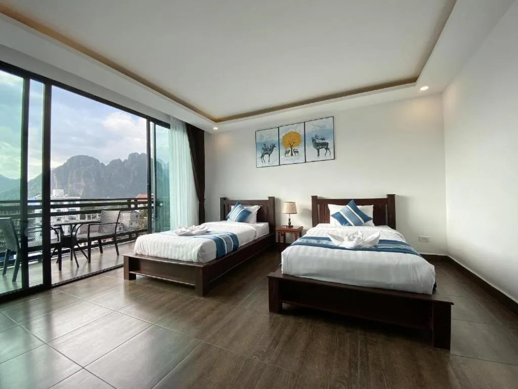 Bed in VANG VIENG TOPVIEW HOTEL