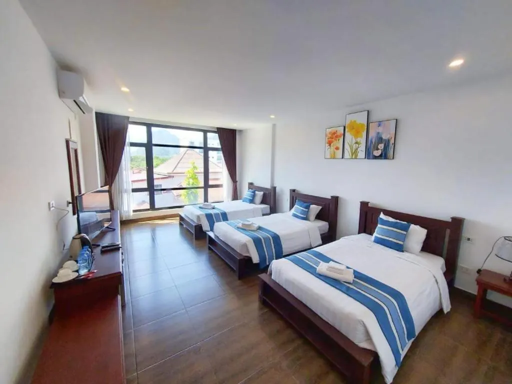 Bed in VANG VIENG TOPVIEW HOTEL