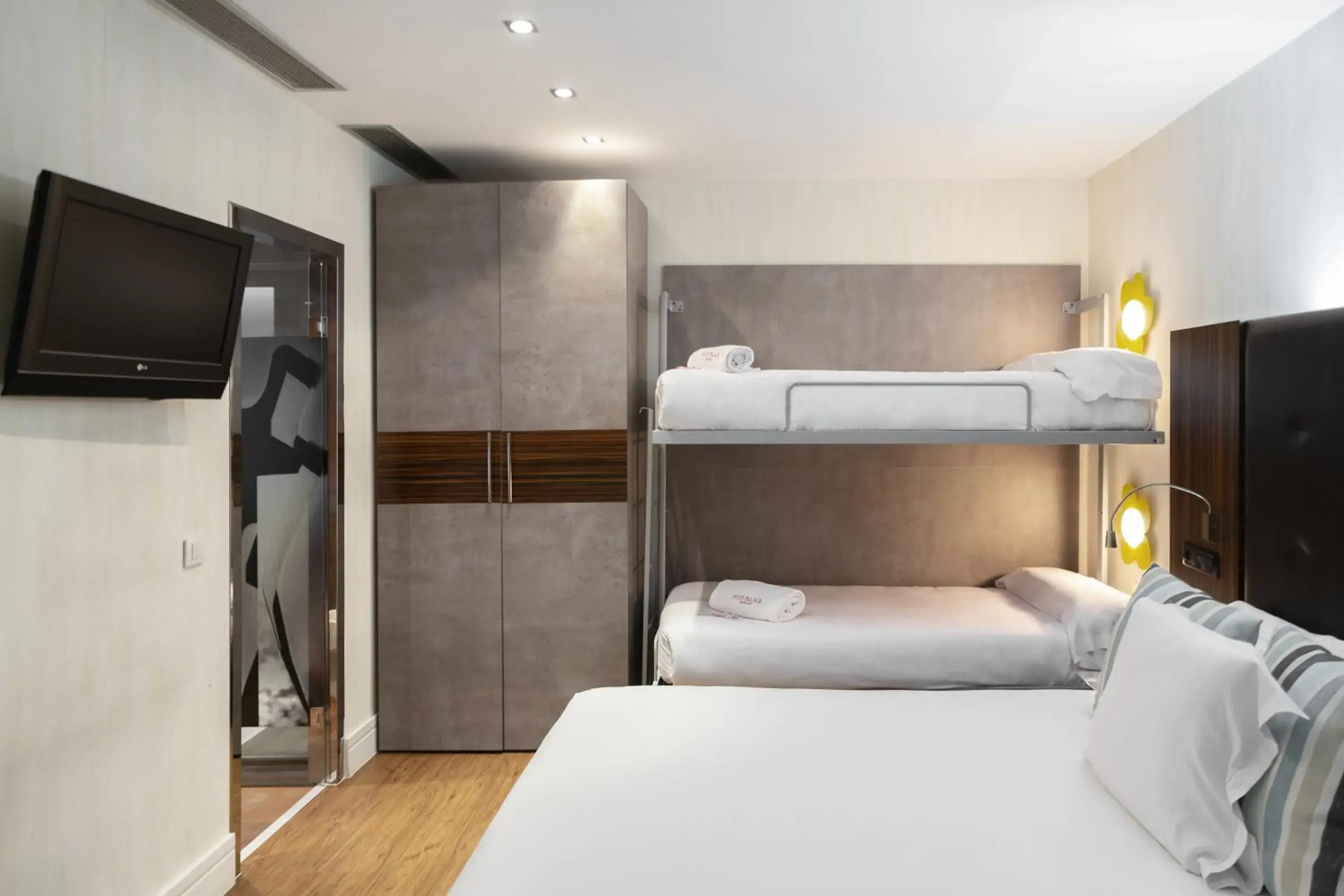 Quadruple Room Interior ( 4 Adults ) in Petit Palace Tamarises Quadruple Room Interior ( 4 Adults ) in Petit Palace Tamarises