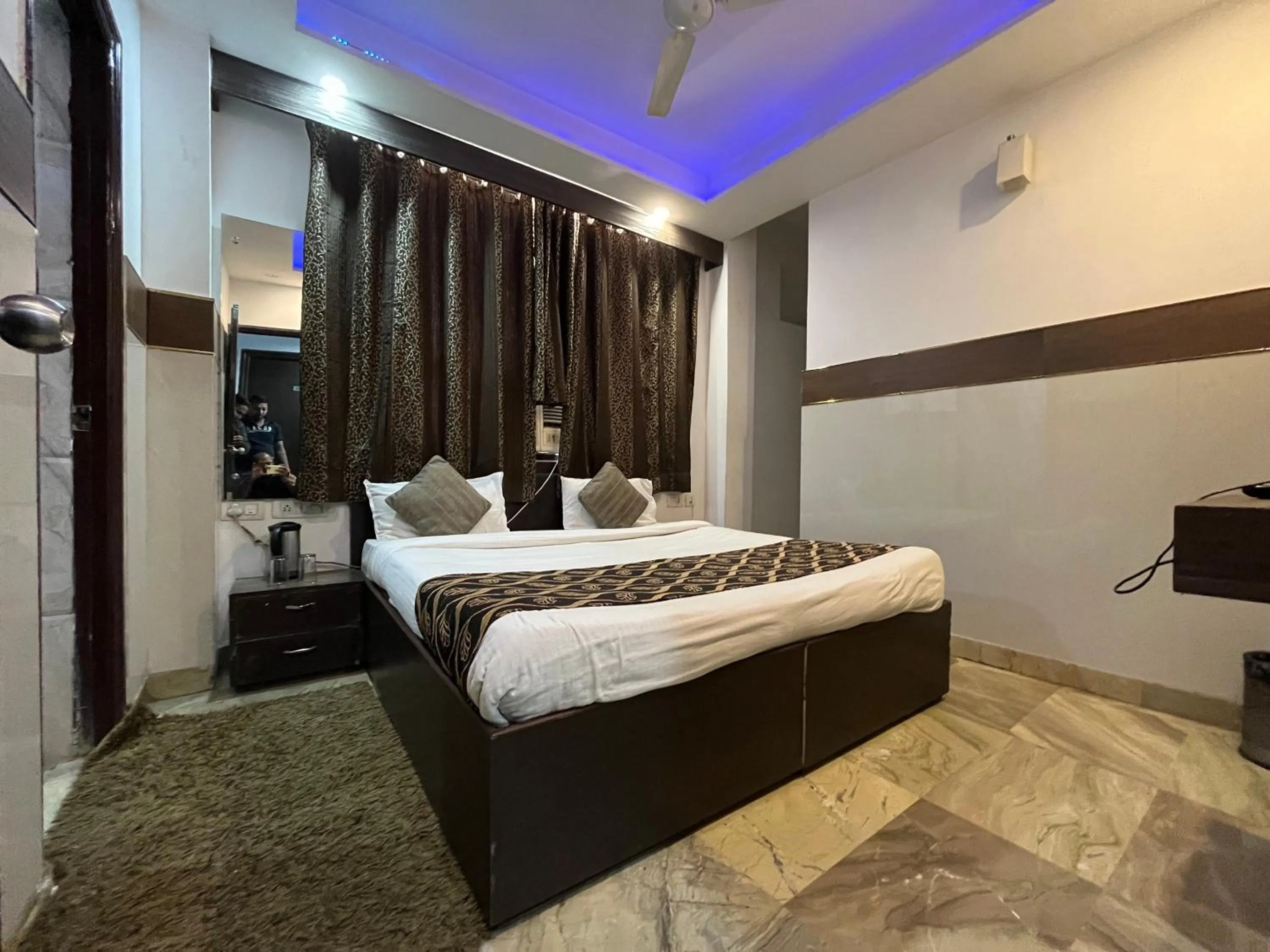 Bed in Hotel Taj Galaxy