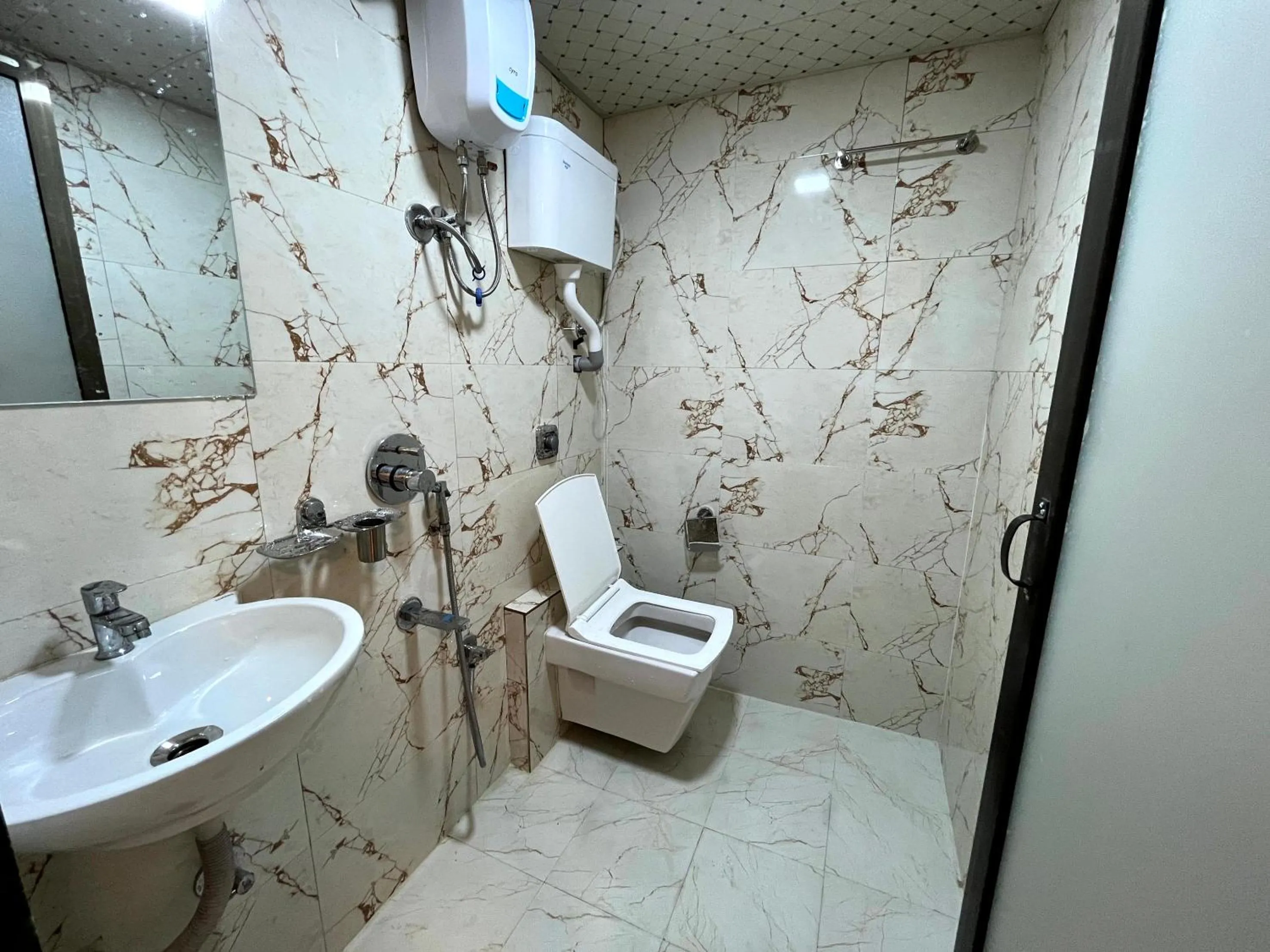 Bathroom in Hotel Delmond Prime- Near NESCO