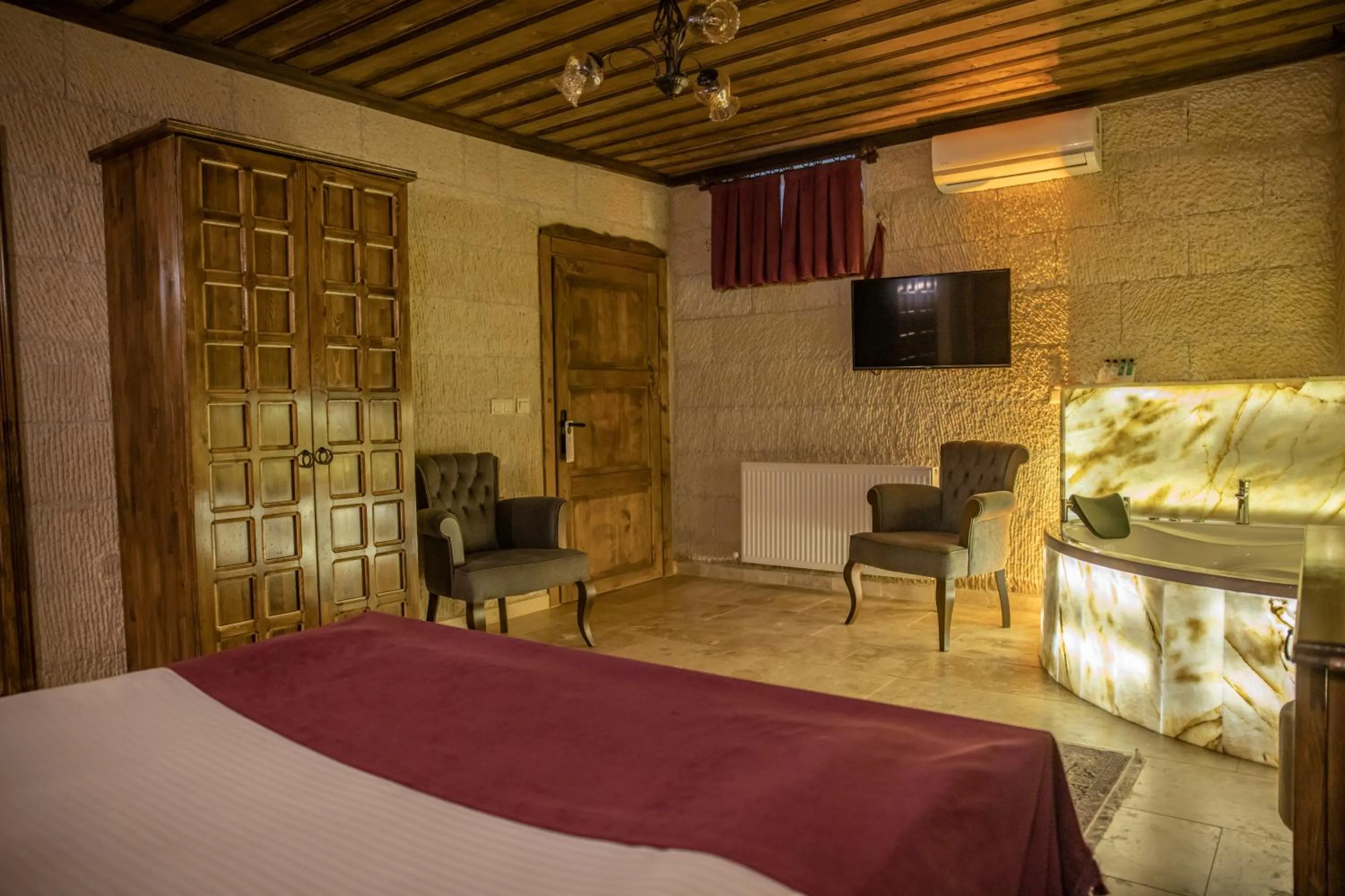 TV and multimedia, Bed in Garden Suites Hotel Cappadocia