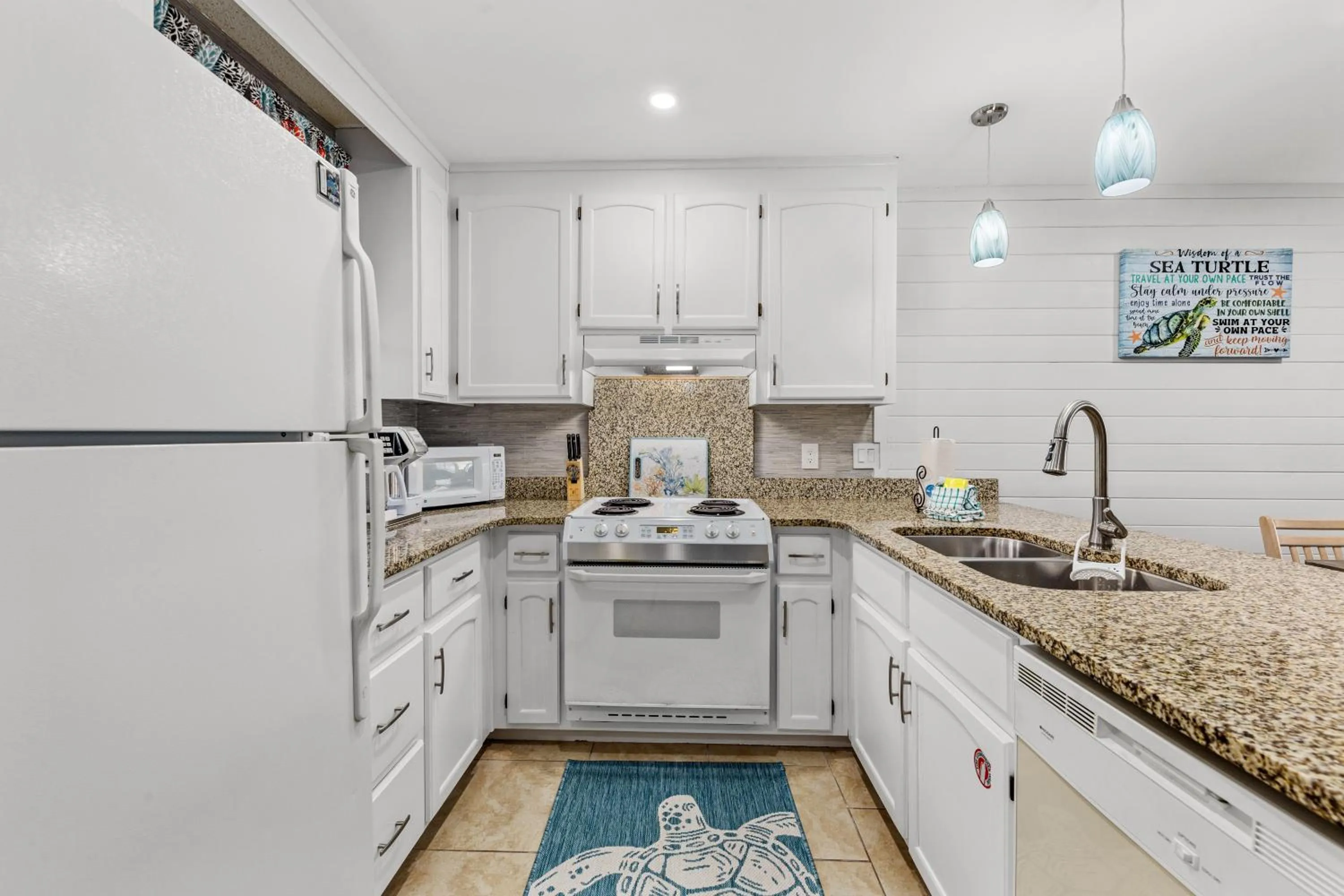 Kitchen or kitchenette in Short Walk to The Beach! Community Pool! Sleeps 6!