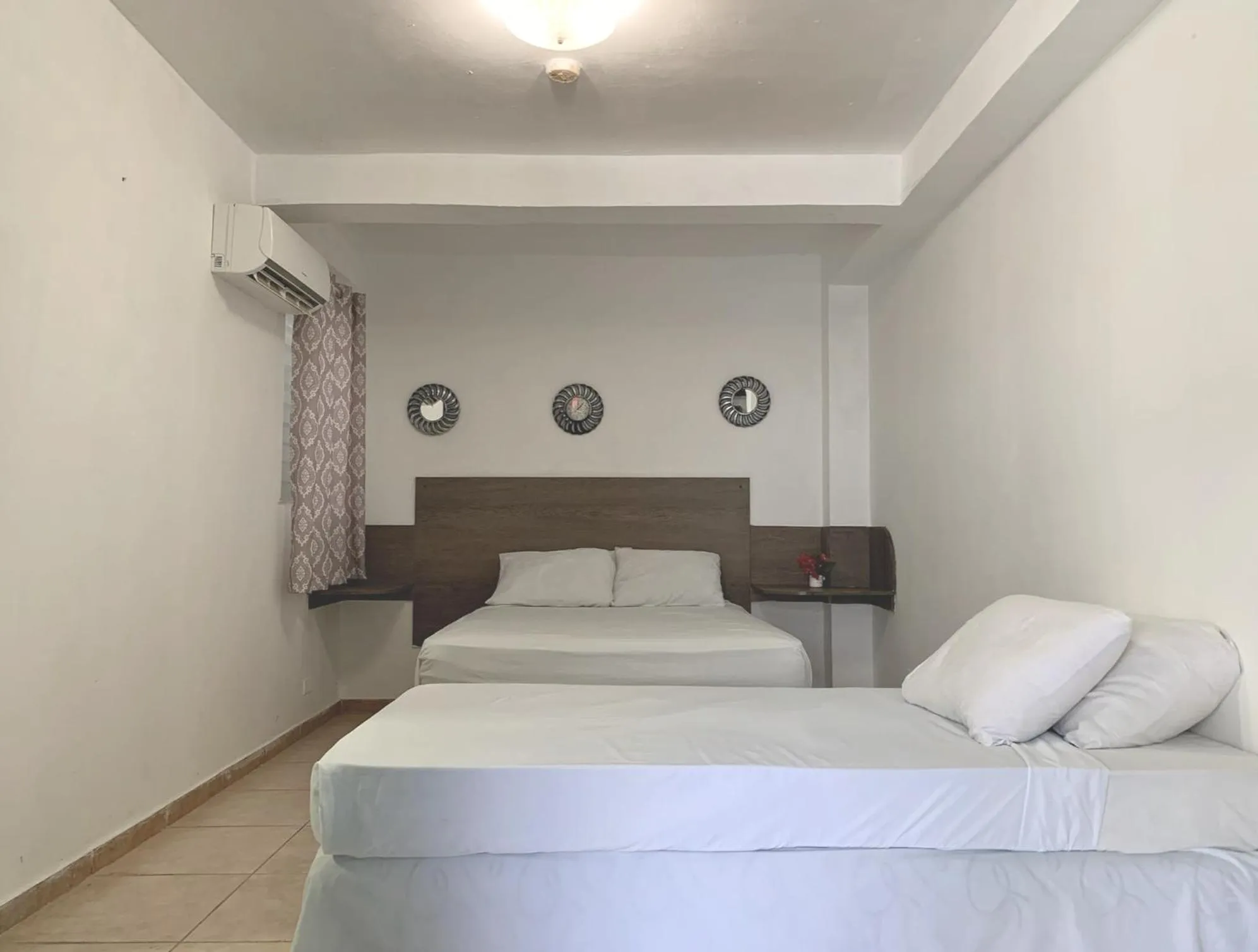 Bed in Pacific Coast Hotel