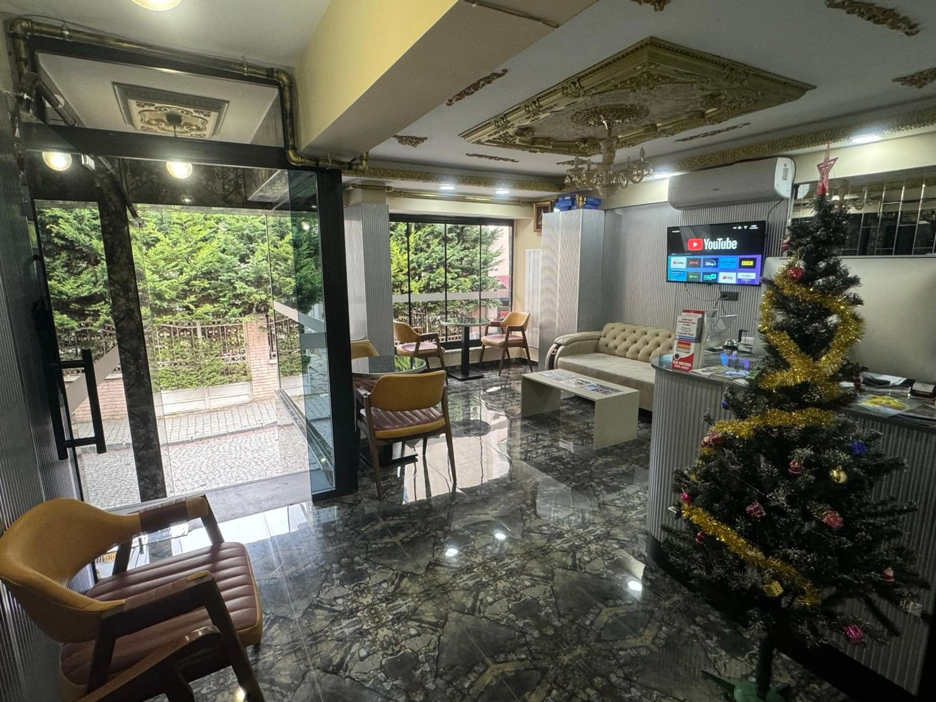 Communal lounge/ TV room in Naif Bey Hotel