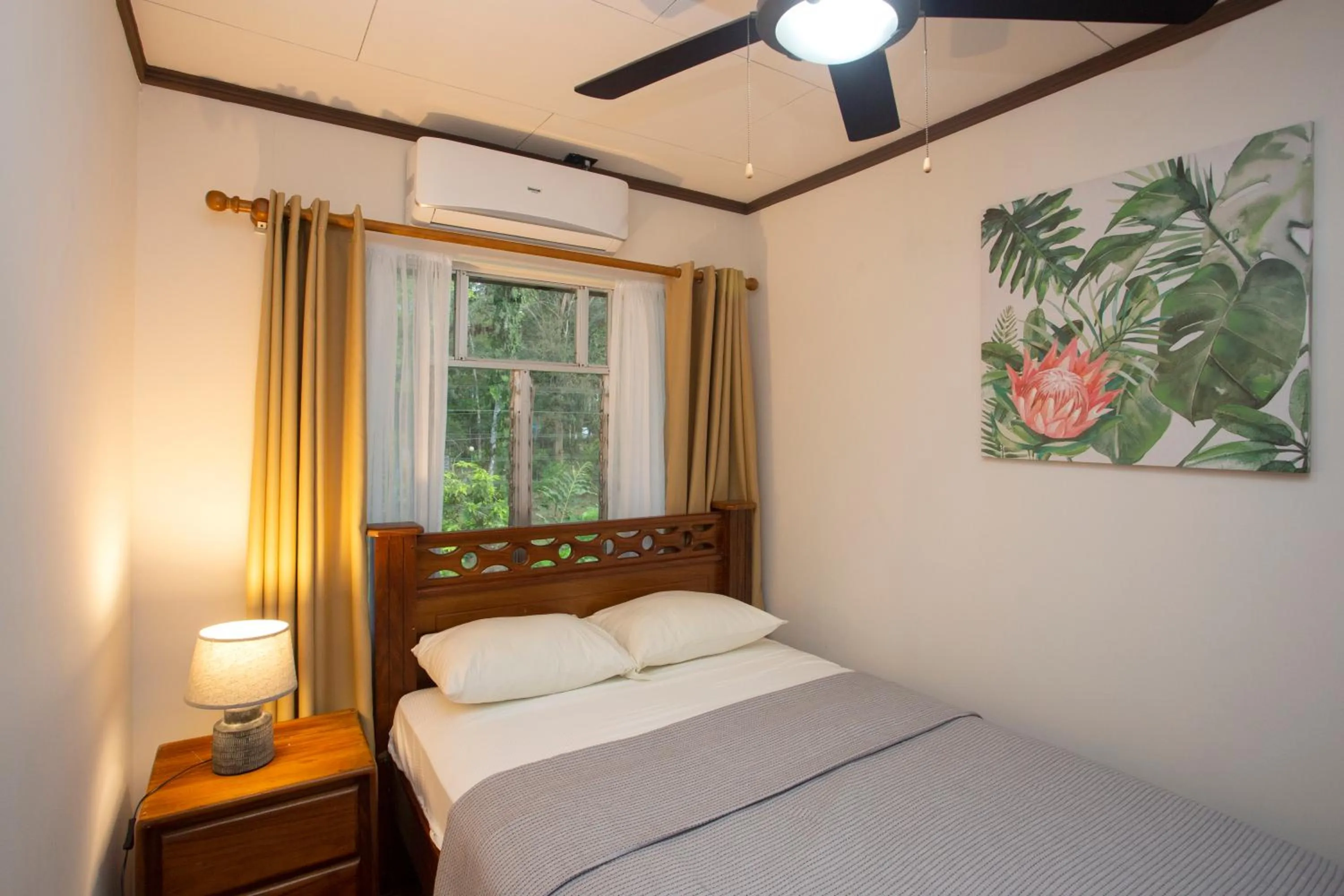 Bed in Manzanillo Caribbean Resort