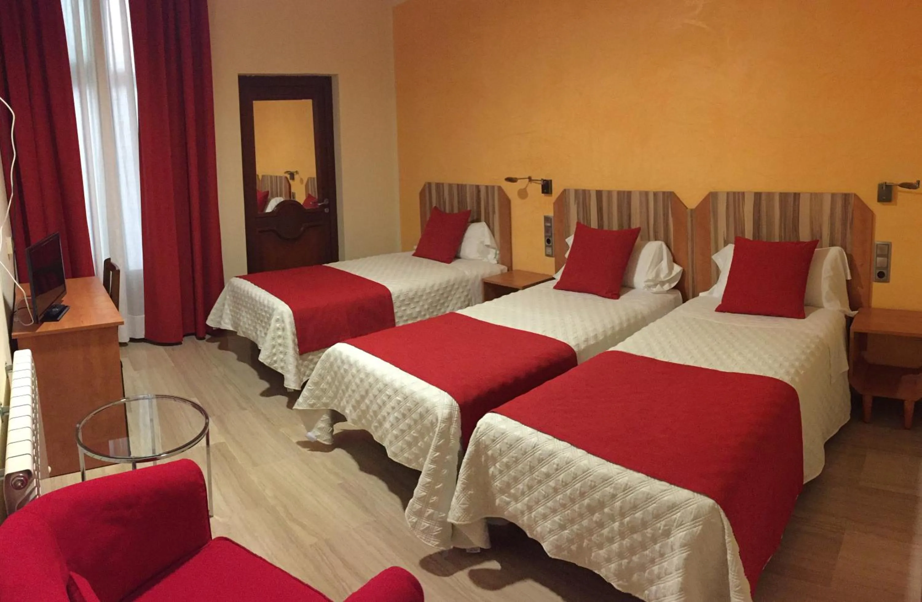 Bedroom in Alba Hotel