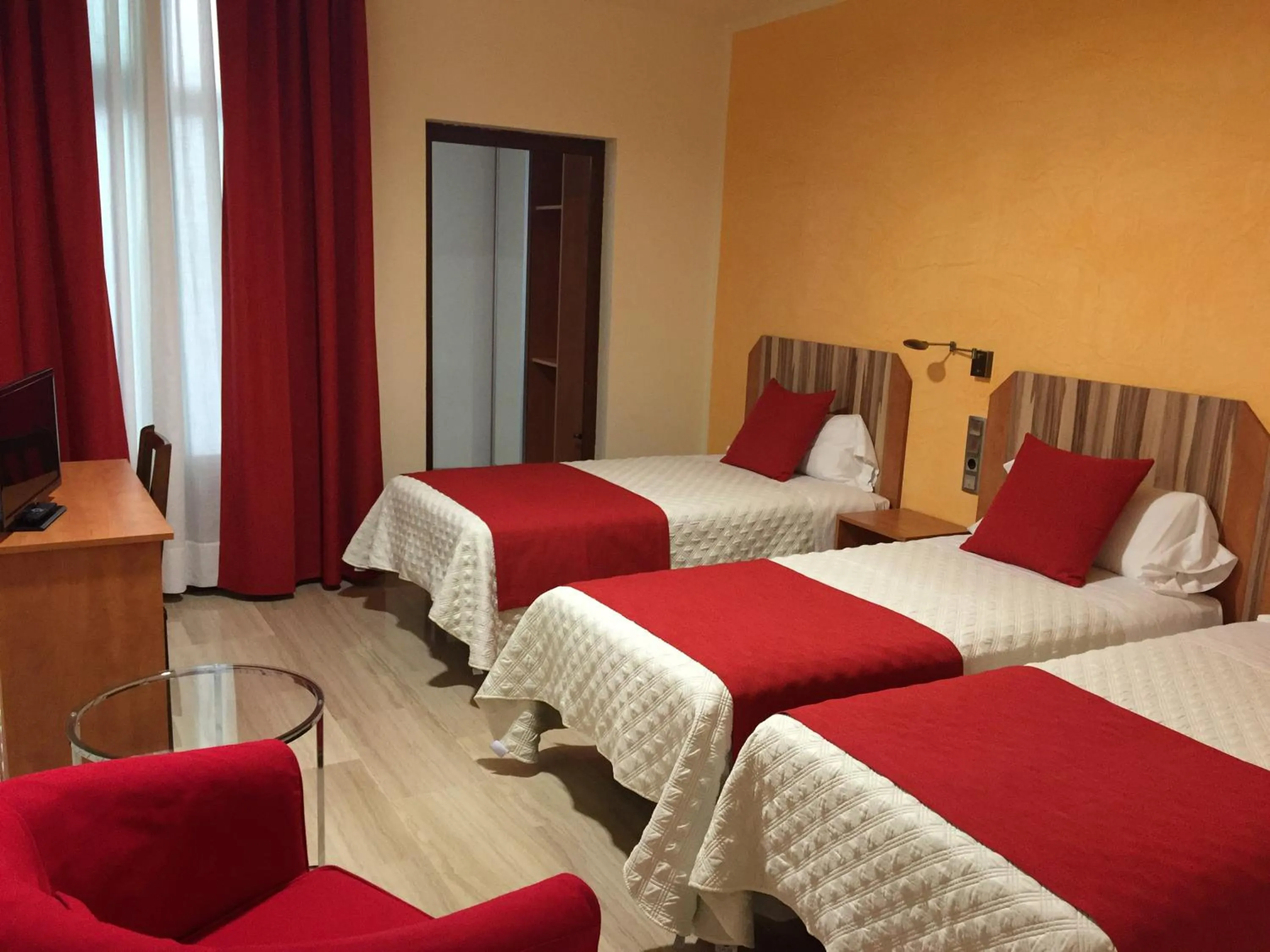 Bedroom in Alba Hotel