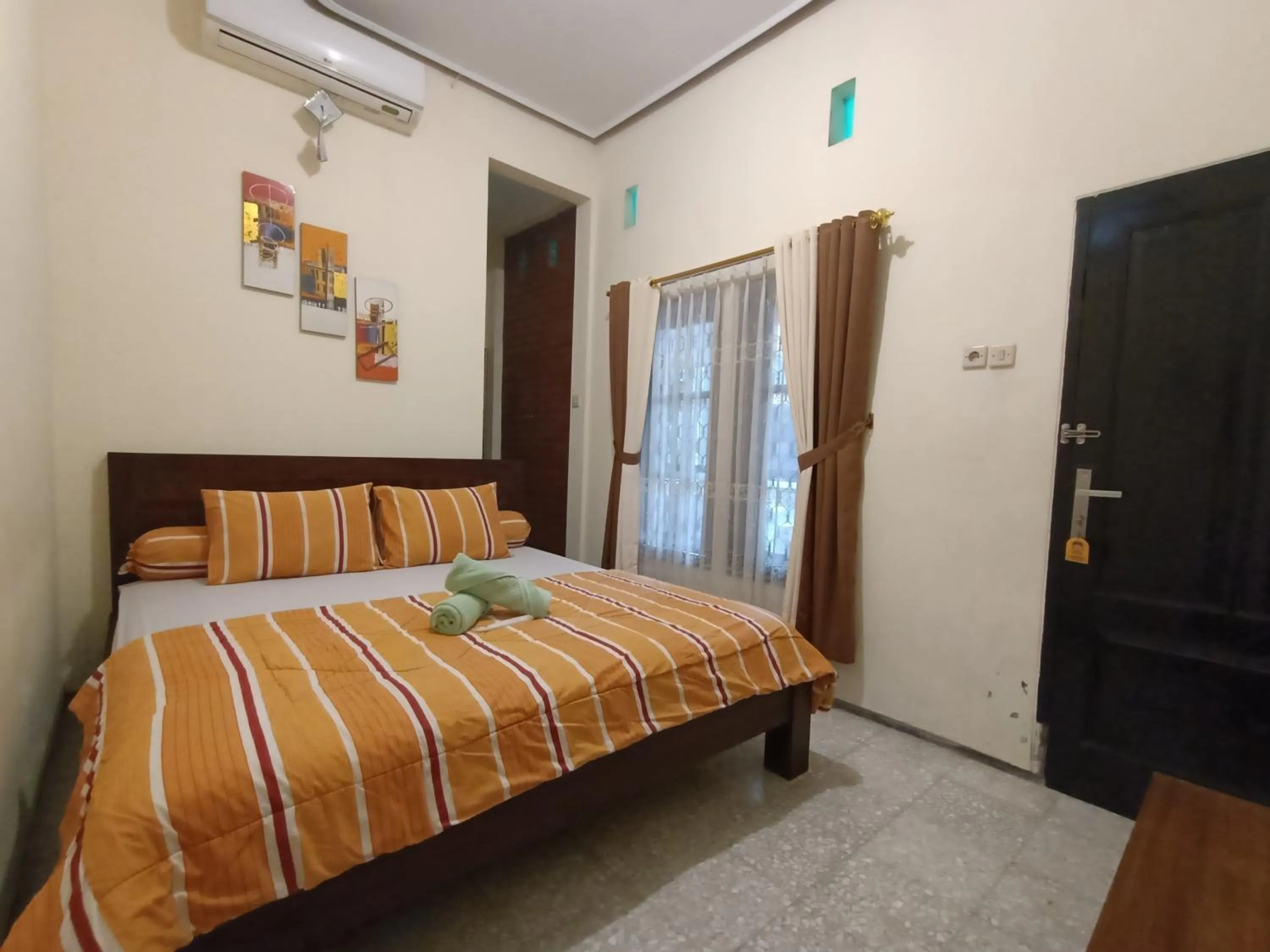 Bed in Rumah Kami Guest House