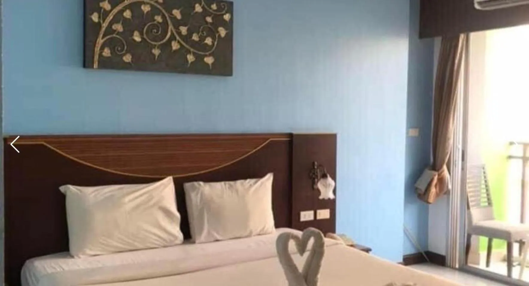 Photo of the whole room, Bed in Issara Patong Beach