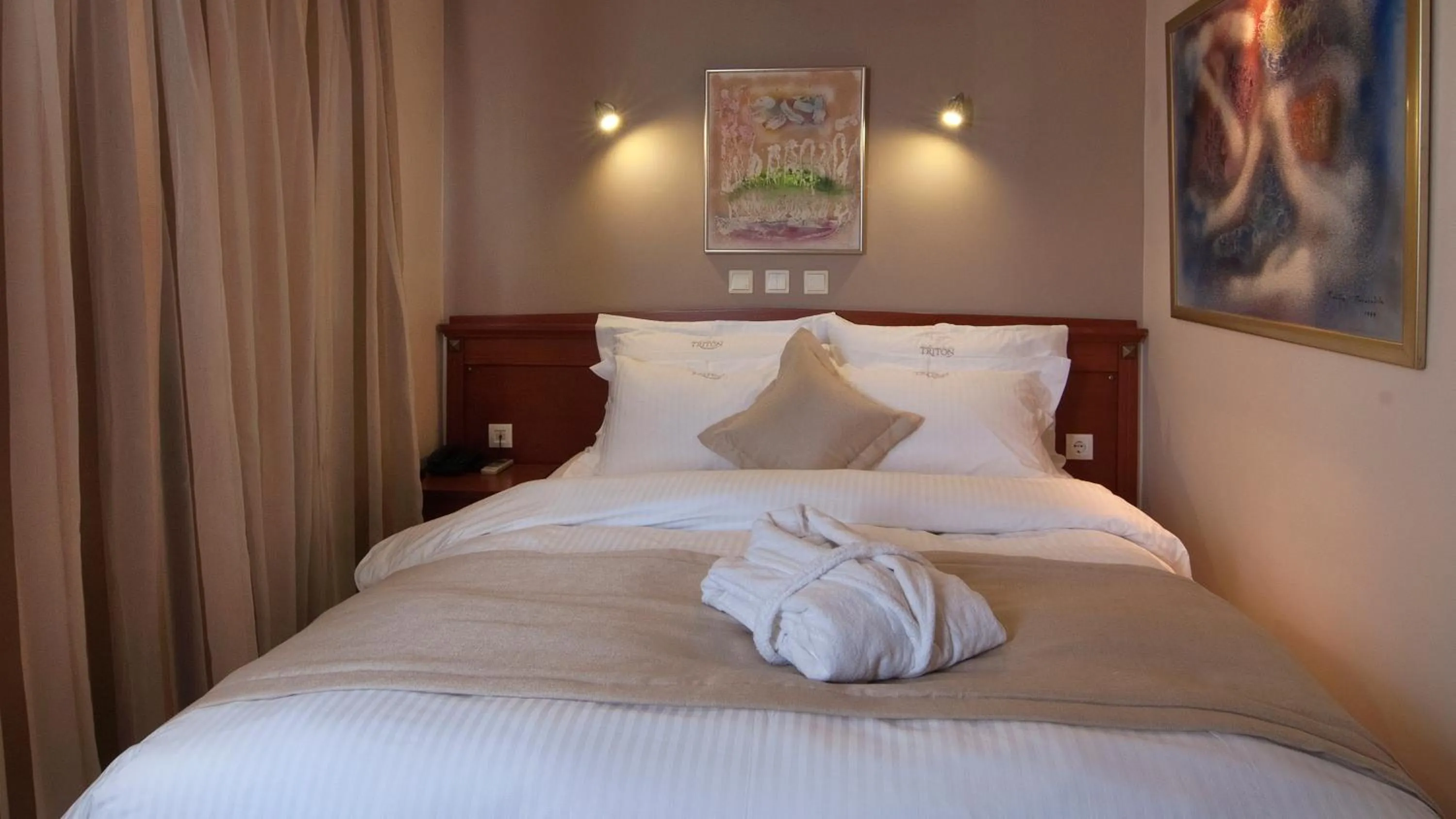 Bed in Triton Hotel Piraeus