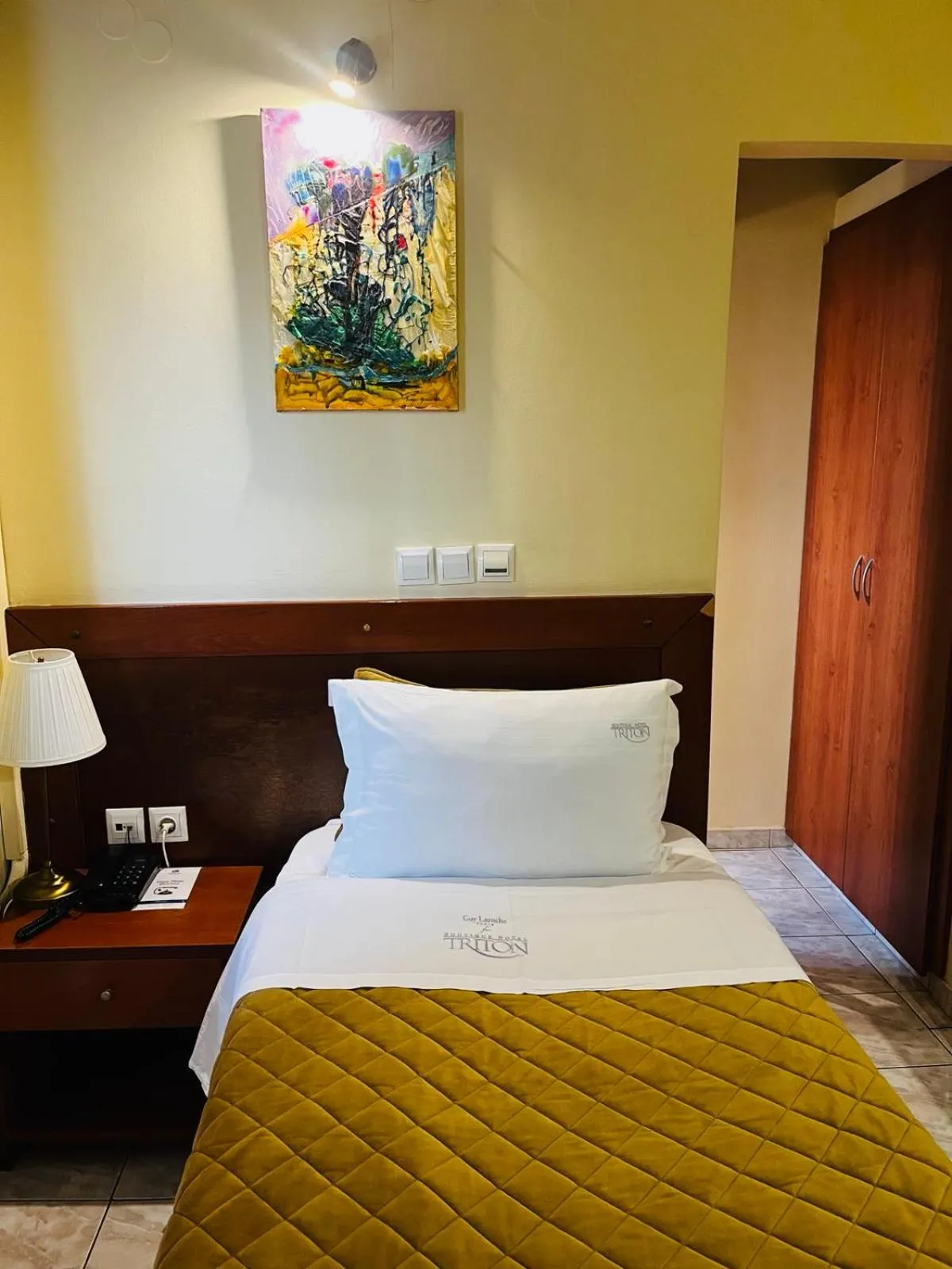 Bed in Triton Hotel Piraeus