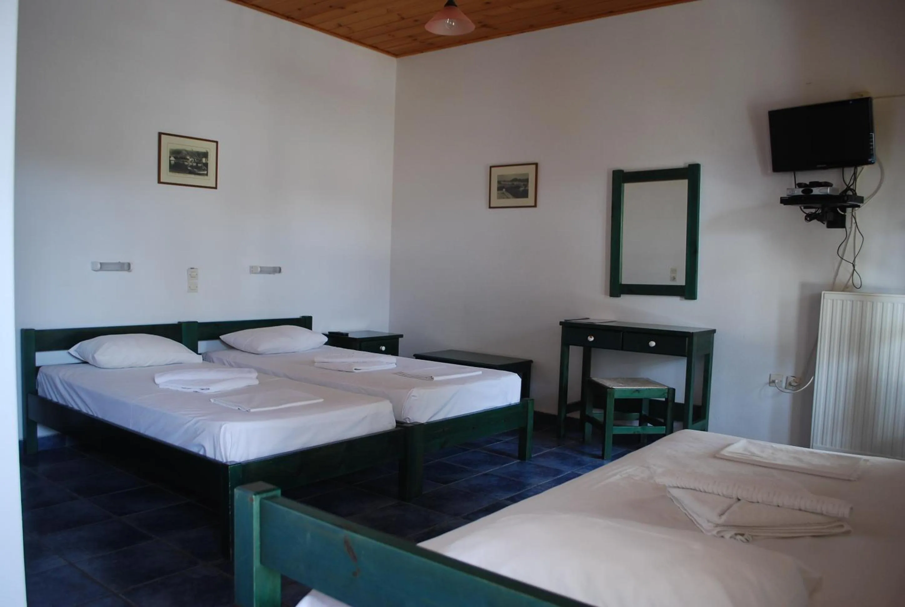 Bed in Siroco's Rooms And Studios