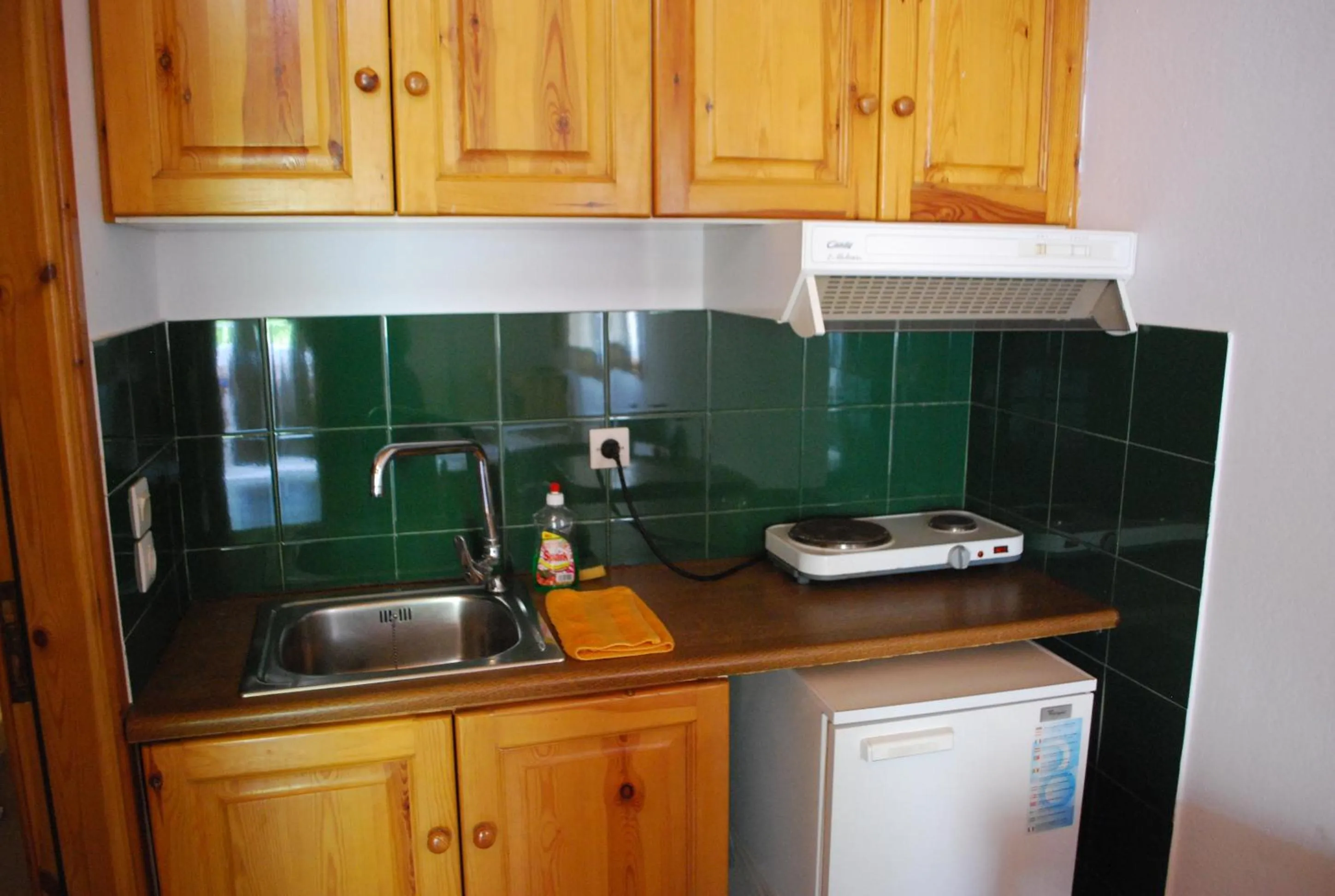 Kitchen or kitchenette in Siroco's Rooms And Studios