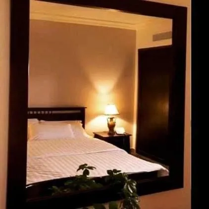 Bedroom, Bed in Tamrah Suites Hotel