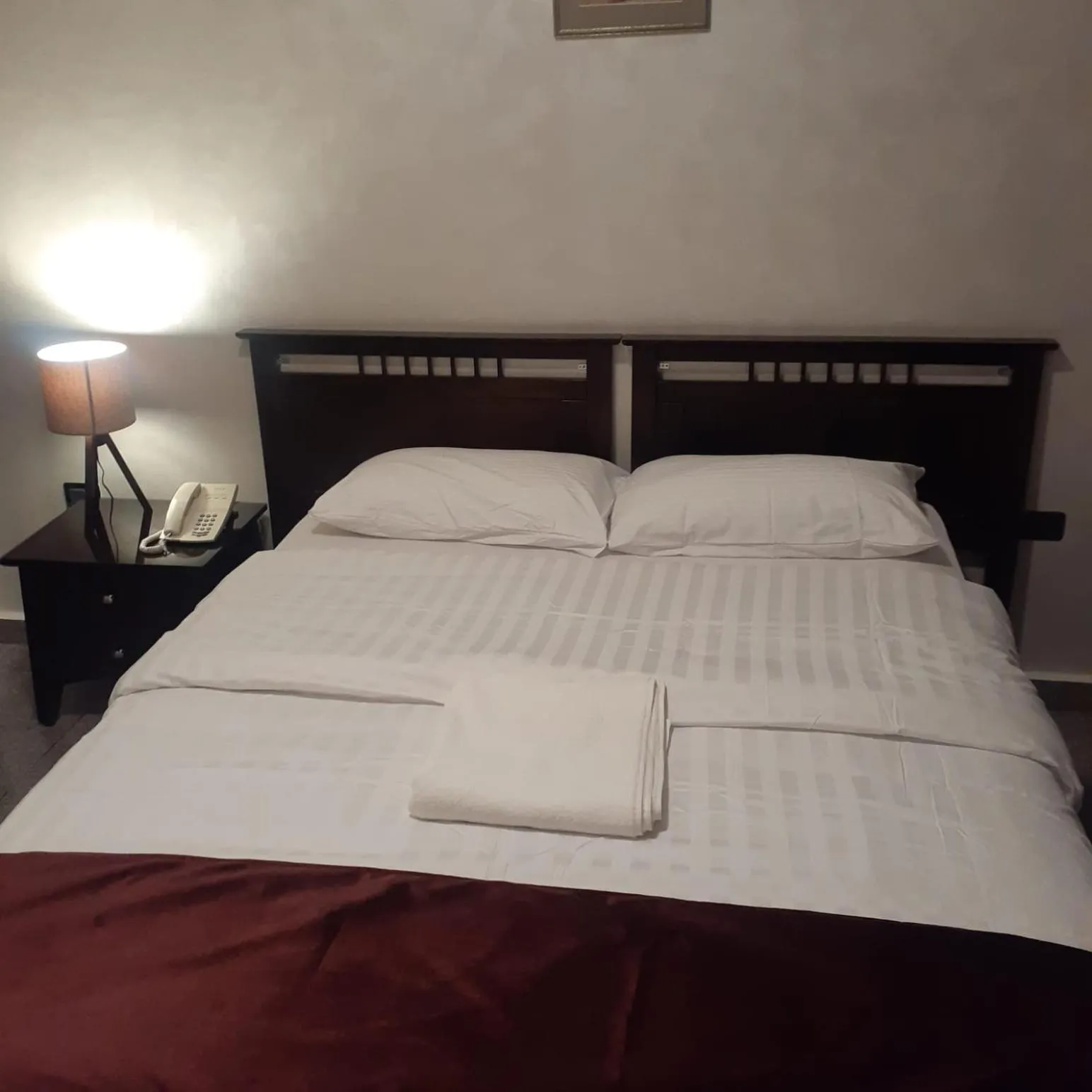 Bed in Tamrah Suites Hotel