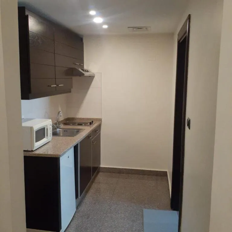 Kitchen or kitchenette in Tamrah Suites Hotel