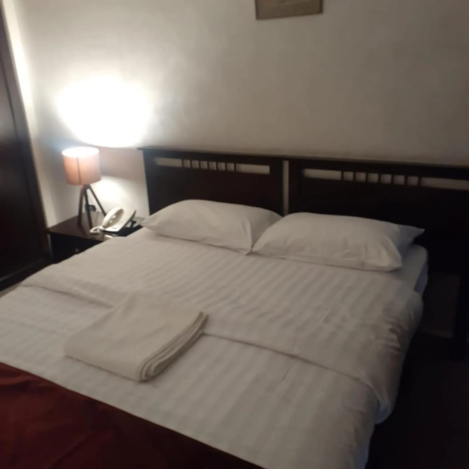 Bed in Tamrah Suites Hotel