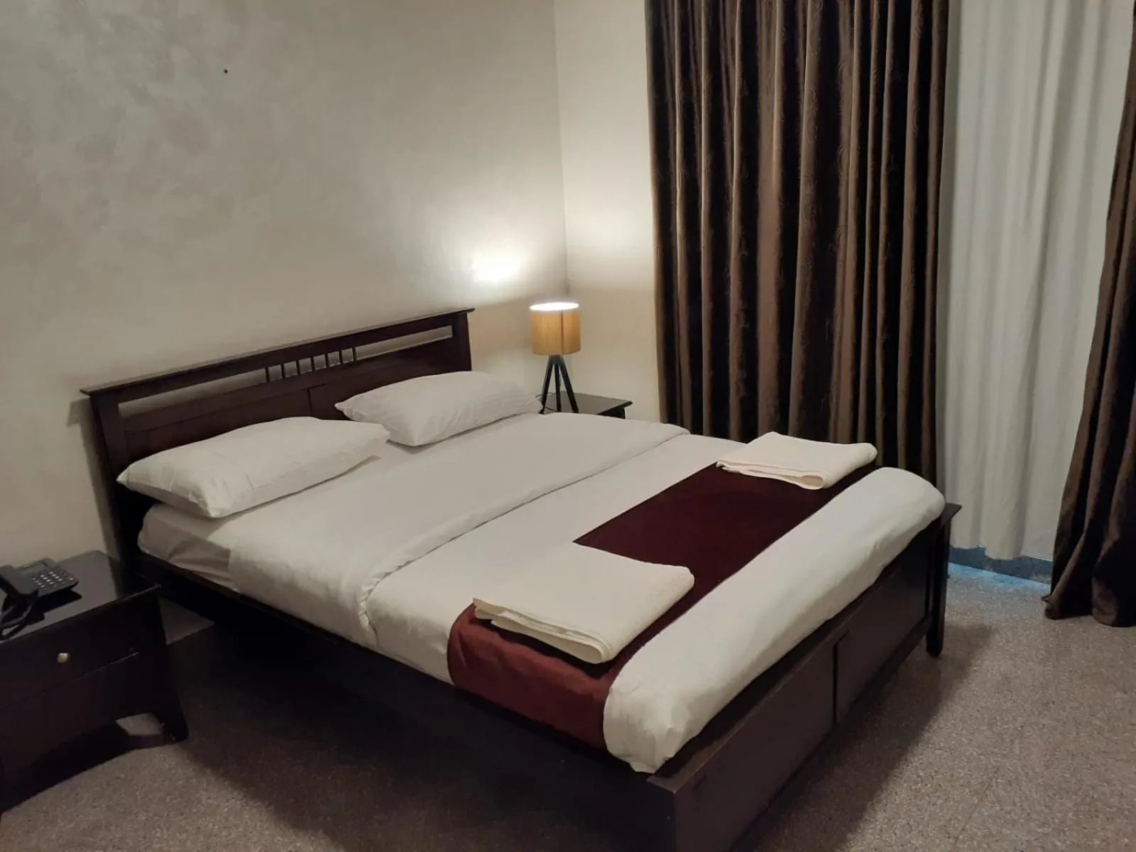 Bed in Tamrah Suites Hotel