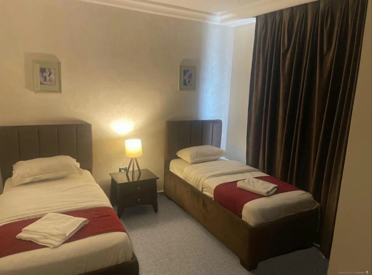 Bed in Tamrah Suites Hotel