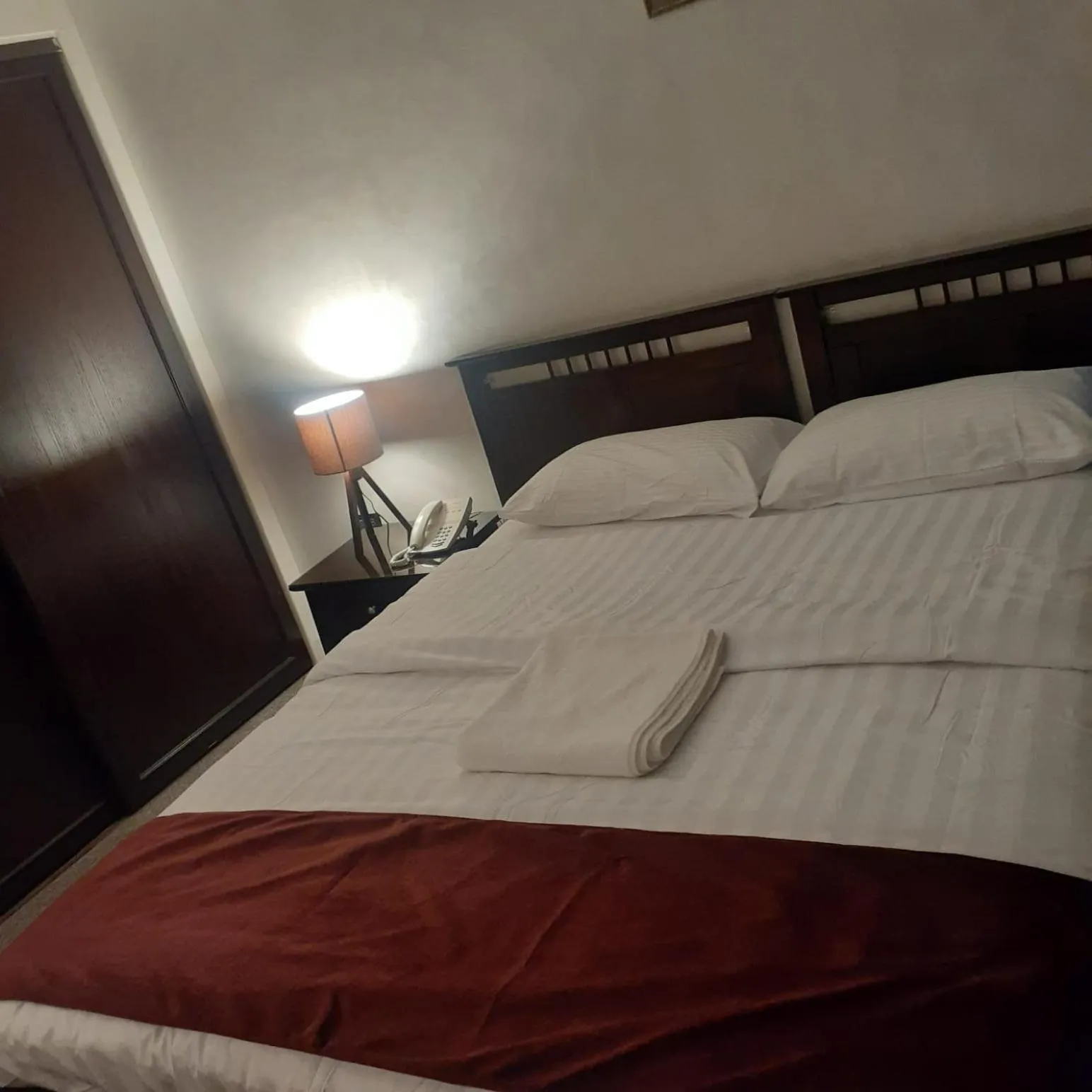 Bed in Tamrah Suites Hotel