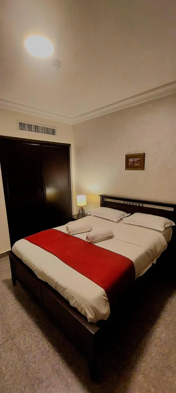 Bed in Tamrah Suites Hotel