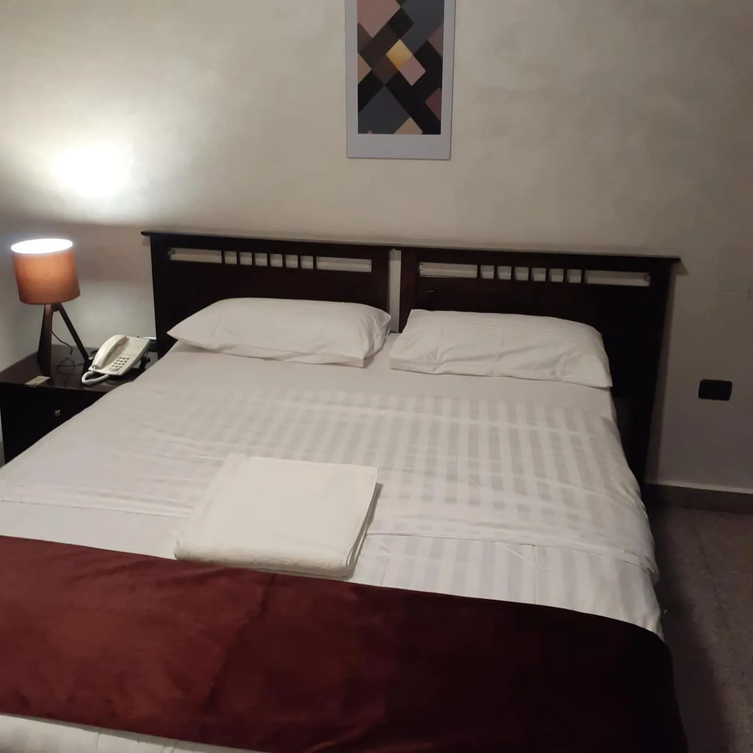 Bed in Tamrah Suites Hotel