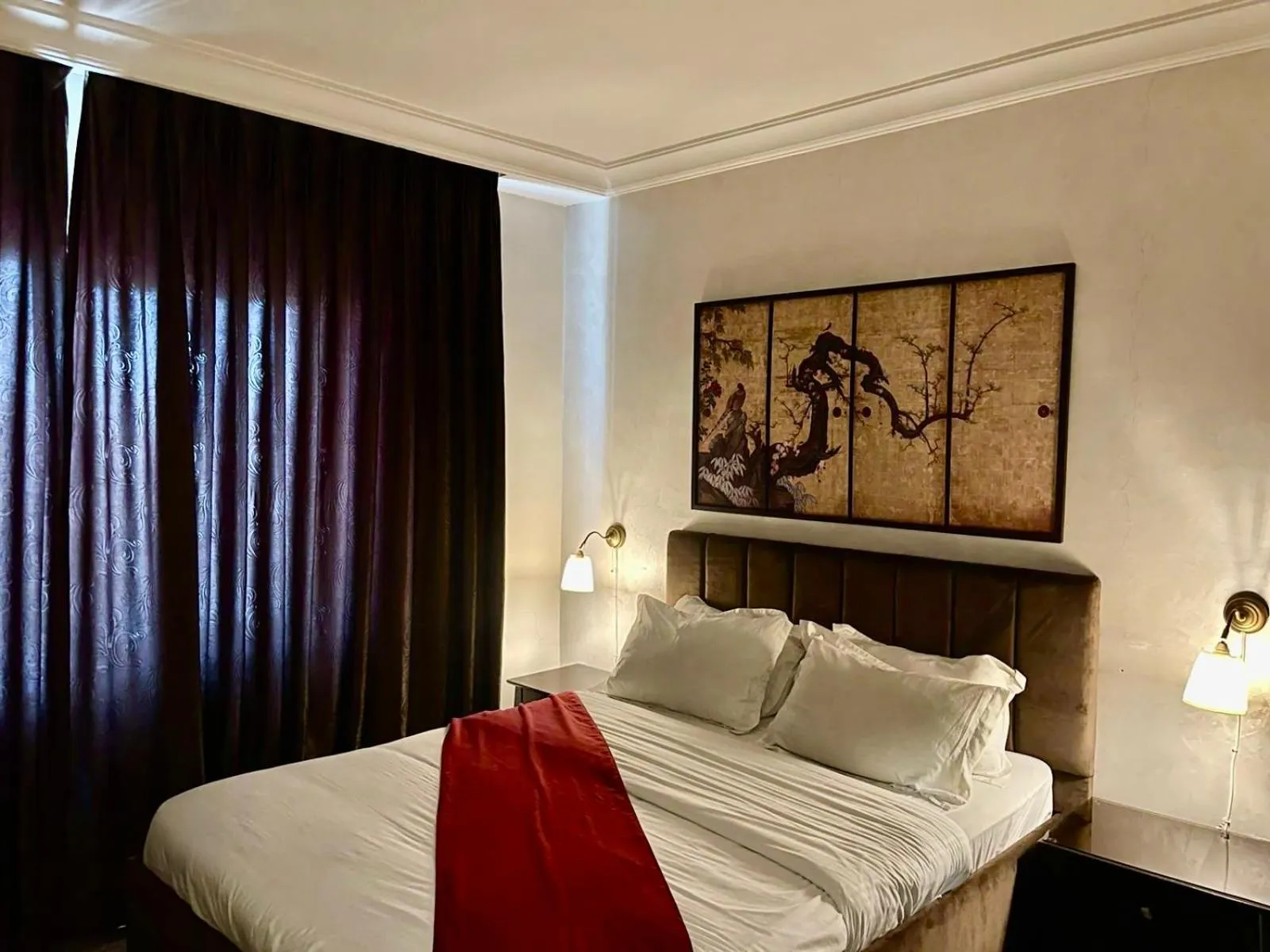 Bed in Tamrah Suites Hotel