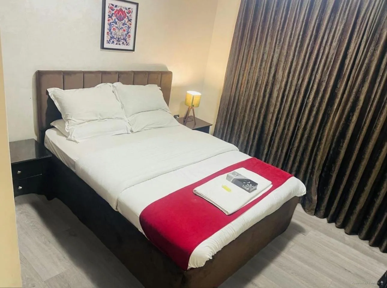 Bed in Tamrah Suites Hotel