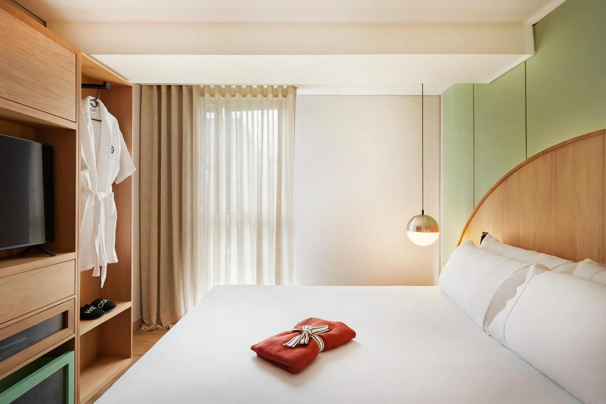 Bed in Wellcomm Spa & Hotel