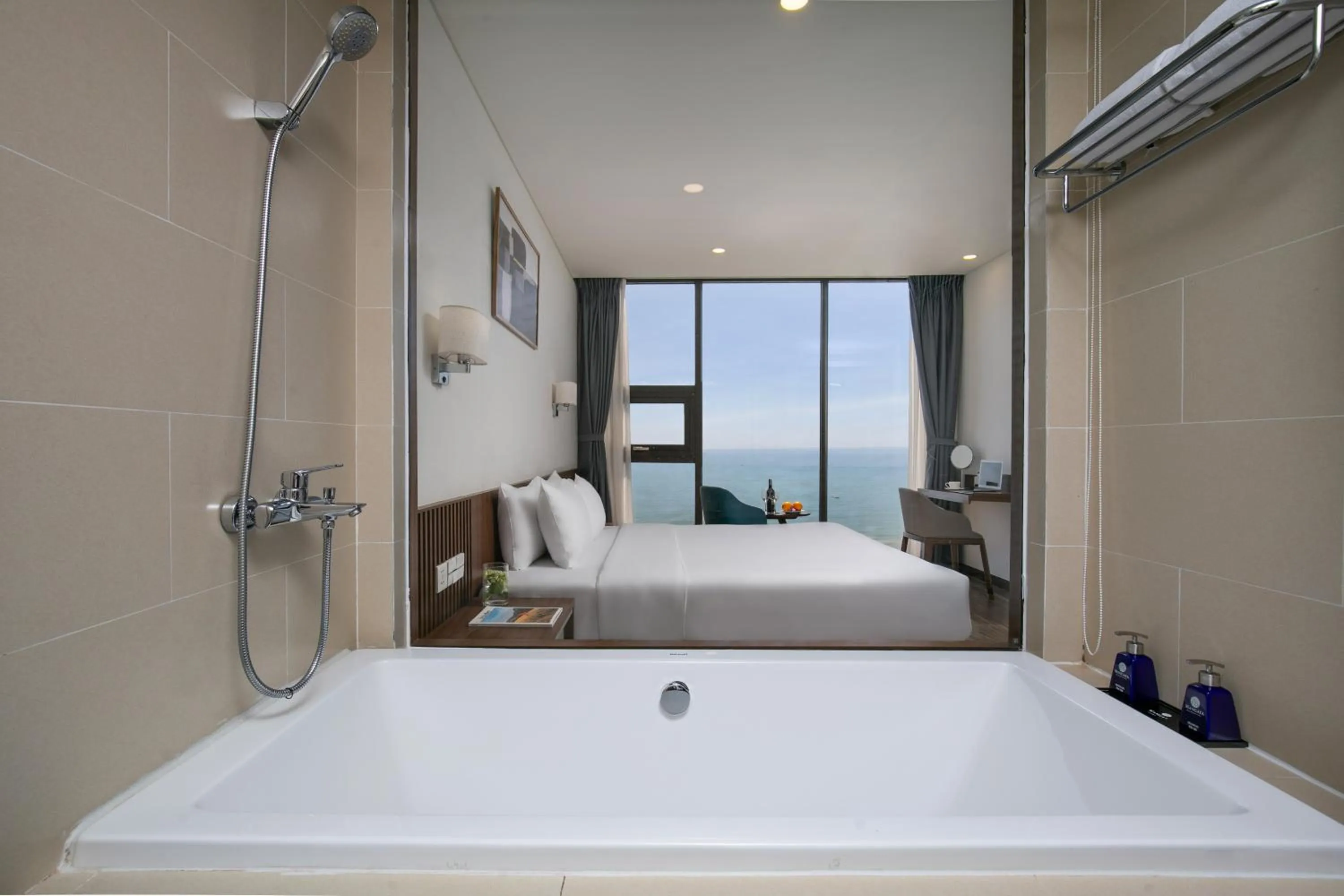 Bathroom, Bed in Mangata Beachfront Hotel - Rooftop Bar Sea View