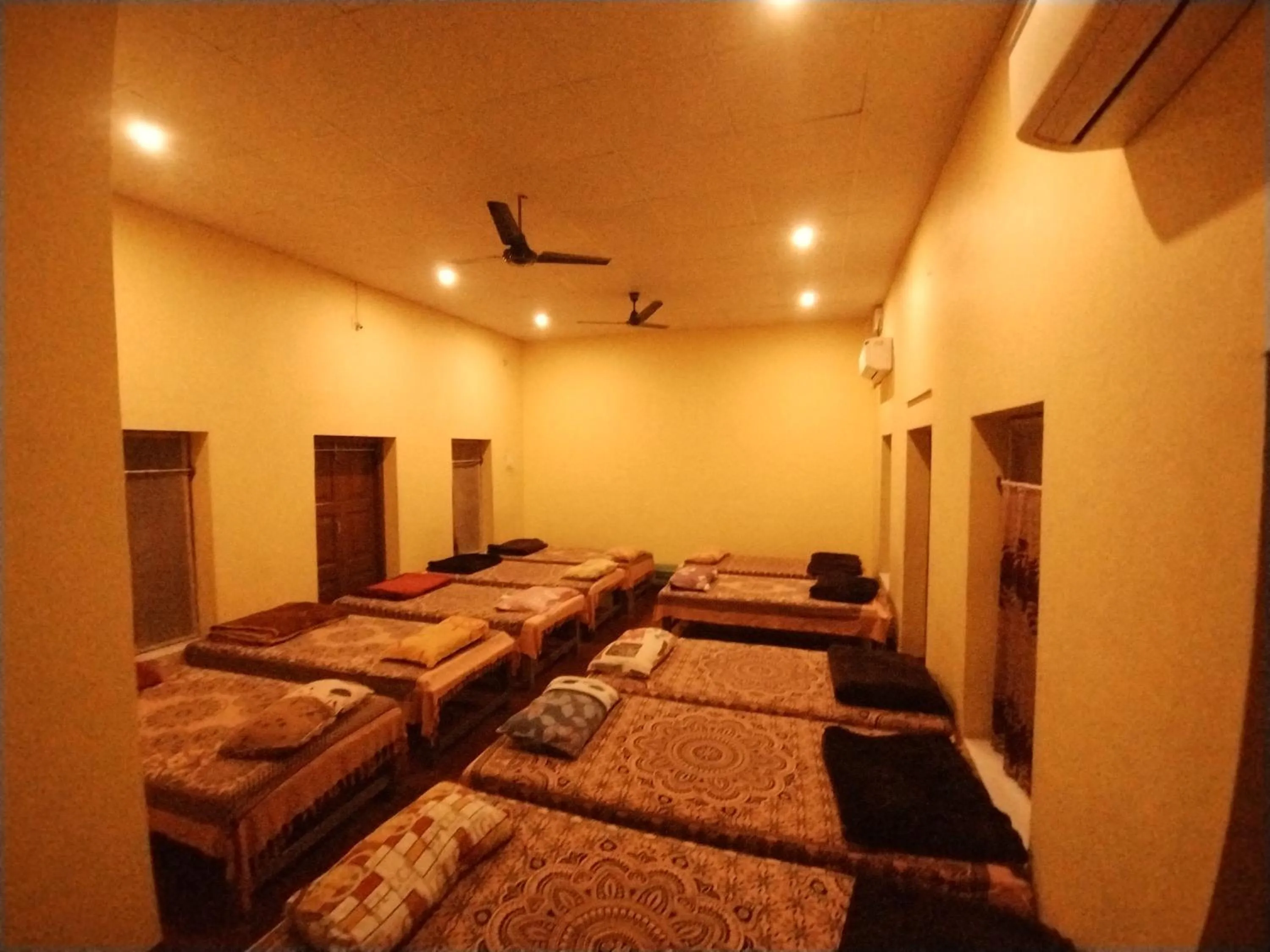 Photo of the whole room, Bed in Bequest Stays In Puri