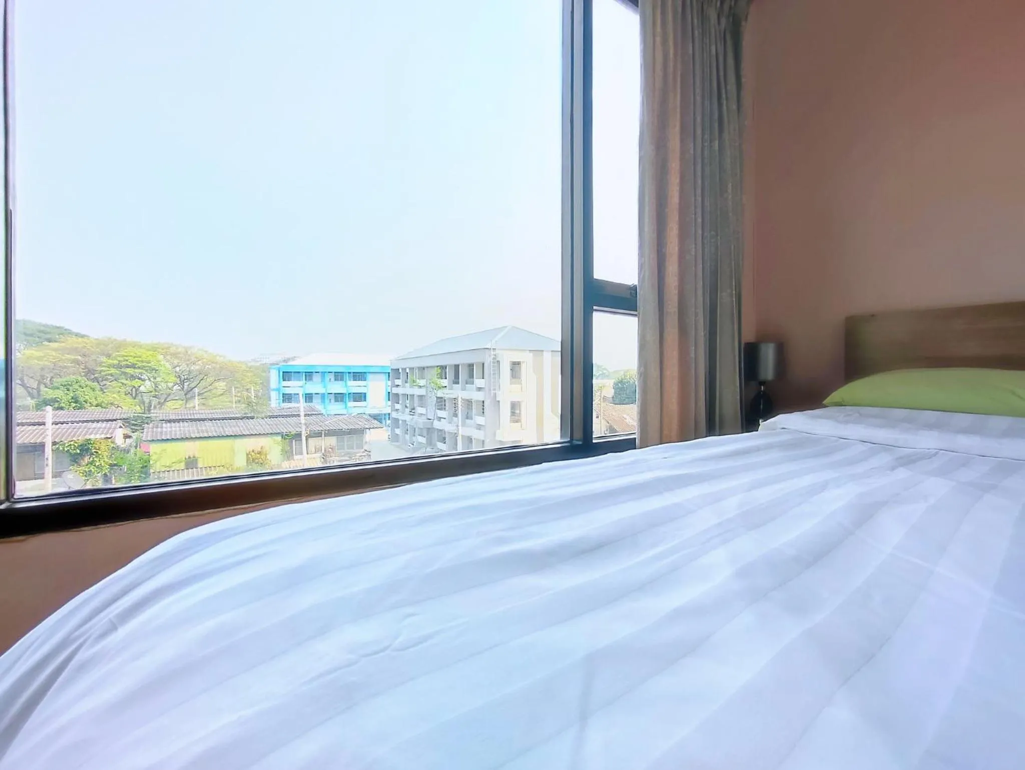 Bed in Deluxe Rooms by Suwan Style Agency