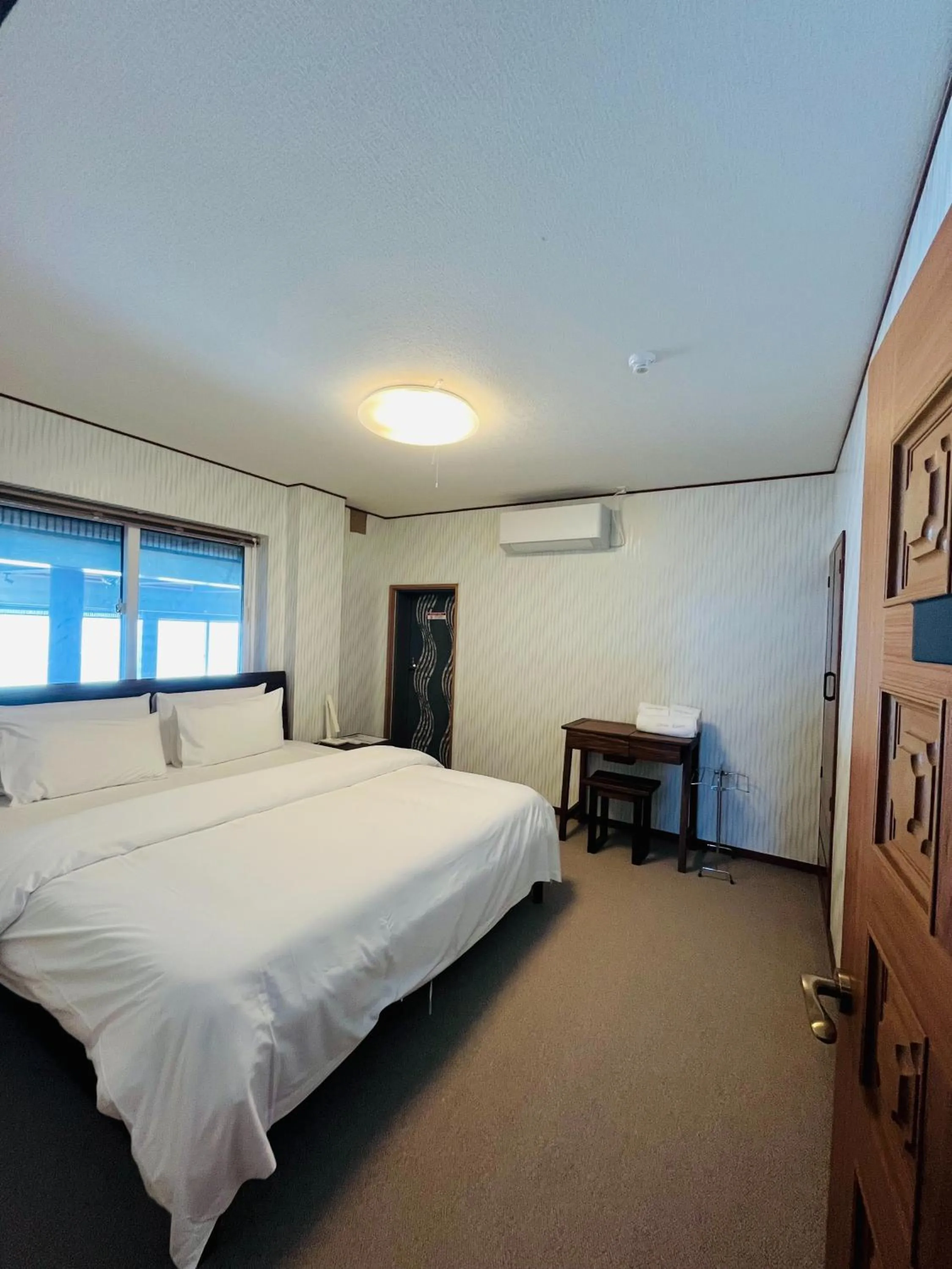 Bed in HOTEL COCOA RESORT