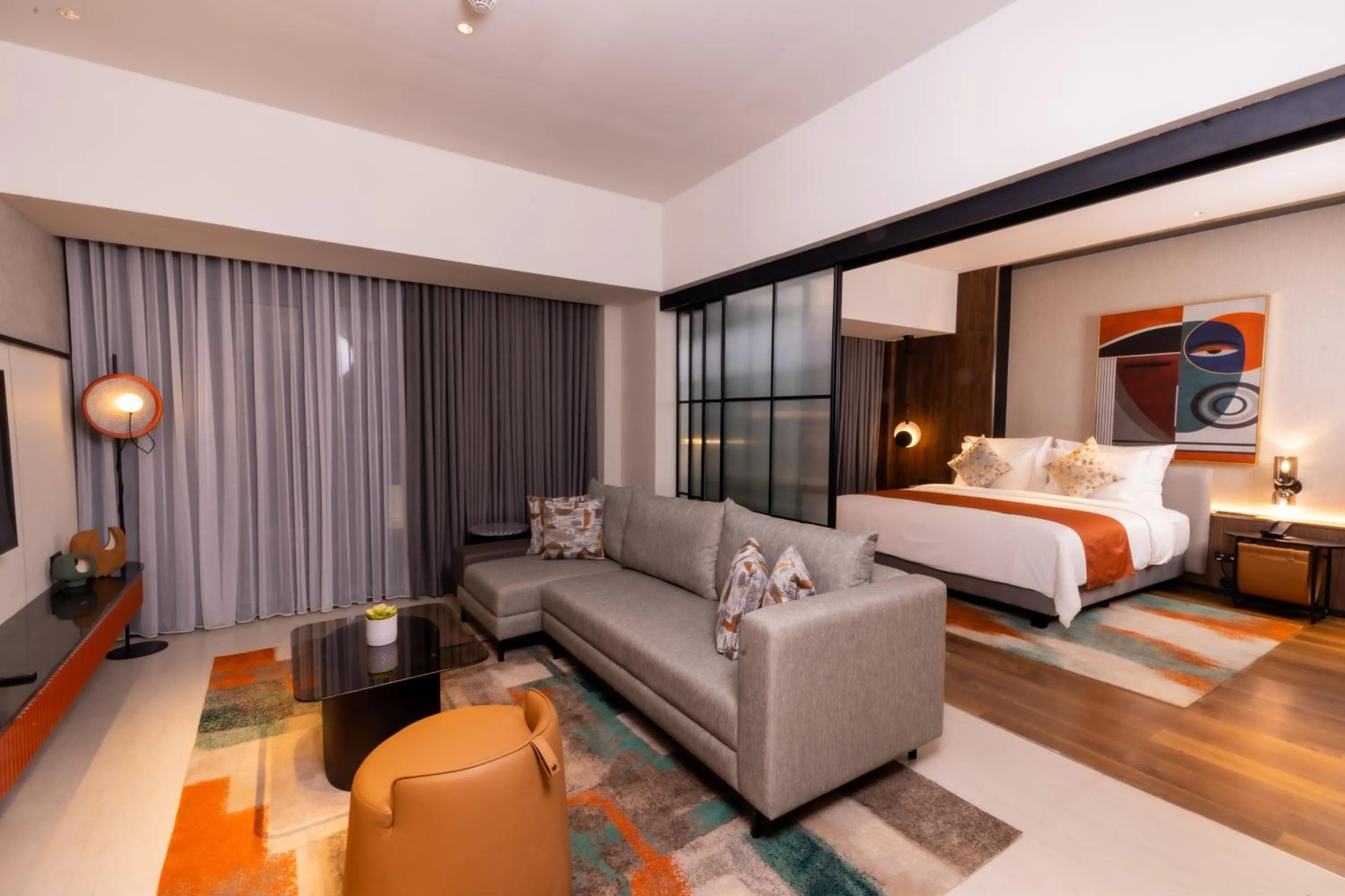 Seating area, Bed in Herloom Hotel & Residence BSD Tangerang